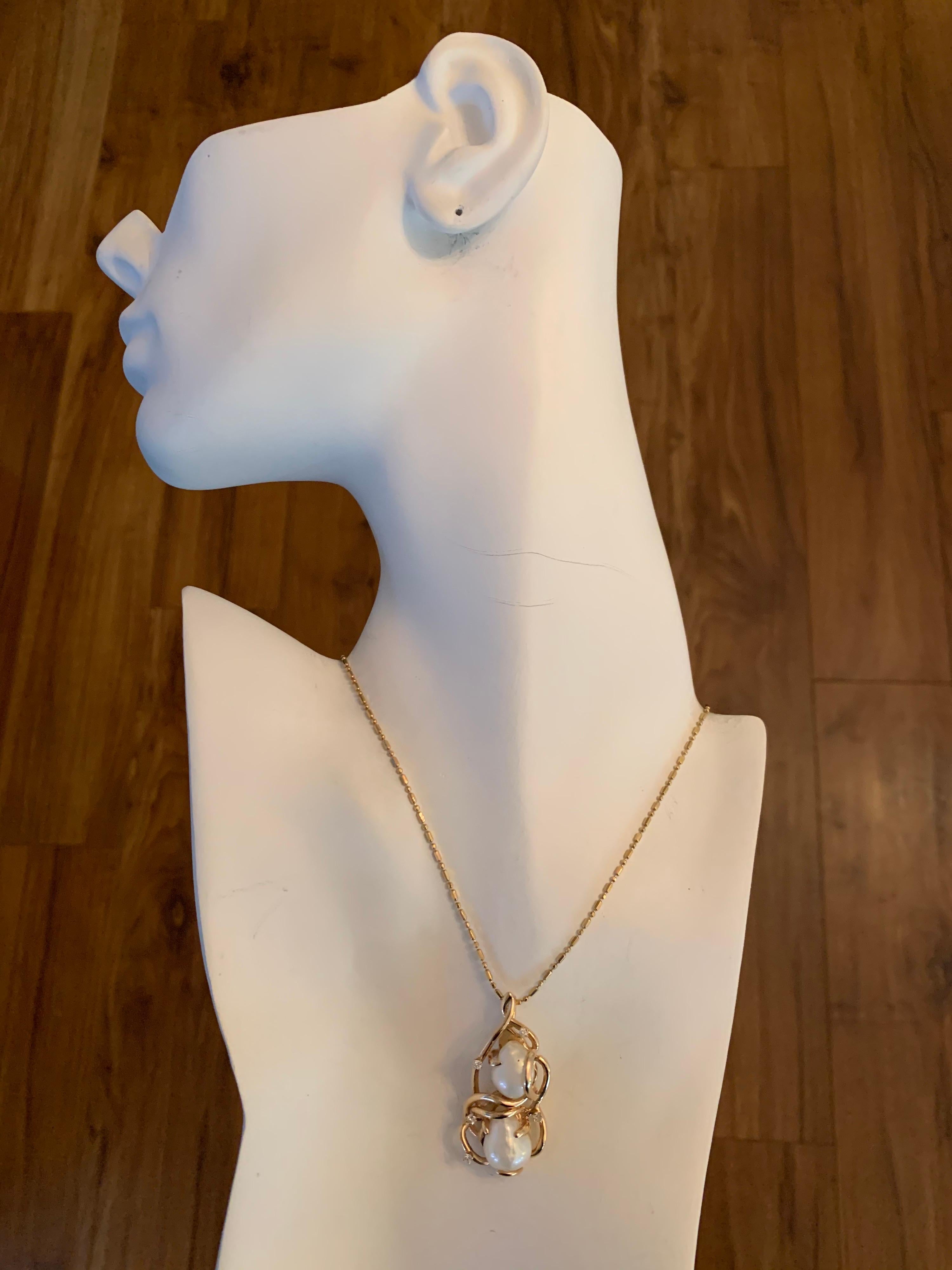 Retro 14k Yellow Gold Pendant 0.20 Carat Natural Diamond (F-G, VS) & Pearl Hand Craft Circa 1980.

Total weight of the pendant is 13.5 grams, chain not included.