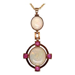 Vintage Gold Pendant 10.50 Carat Natural White Cabochon Opal and Ruby Gem