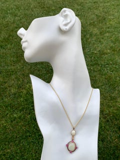 Retro Gold Pendant 10.50 Carat Natural White Cabochon Opal and Ruby Gem