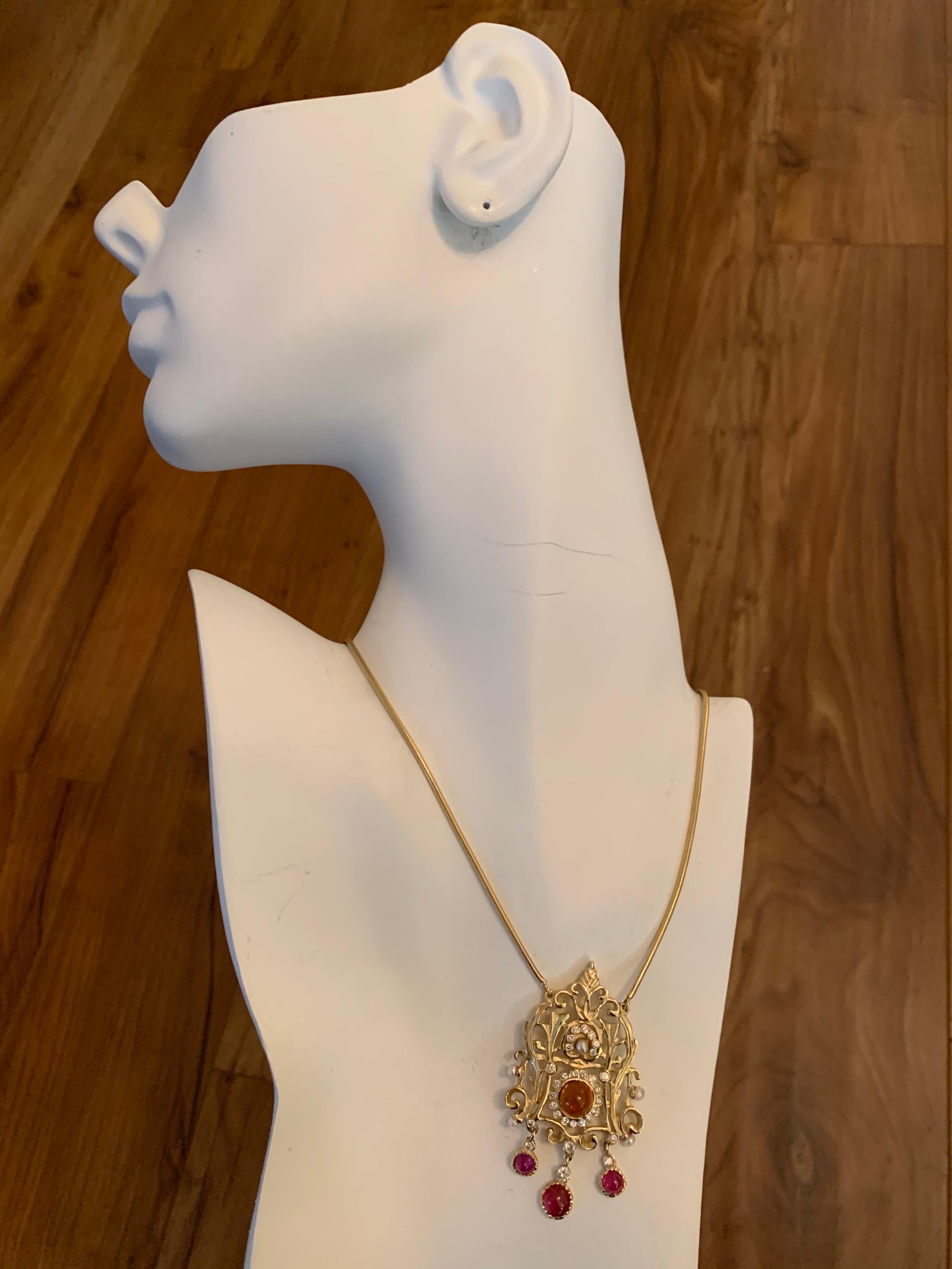 Retro 14k Yellow Gold Pendant 6 Carat Natural Diamond, Ruby, Quartz Gemstone Circa 1960. 

The piece is set with 30 Natural diamonds weighing approximately 1 carat (G-I, VS-I), 3 natural cabochons & 1 quartz weighing approximately 5 carats. 

The