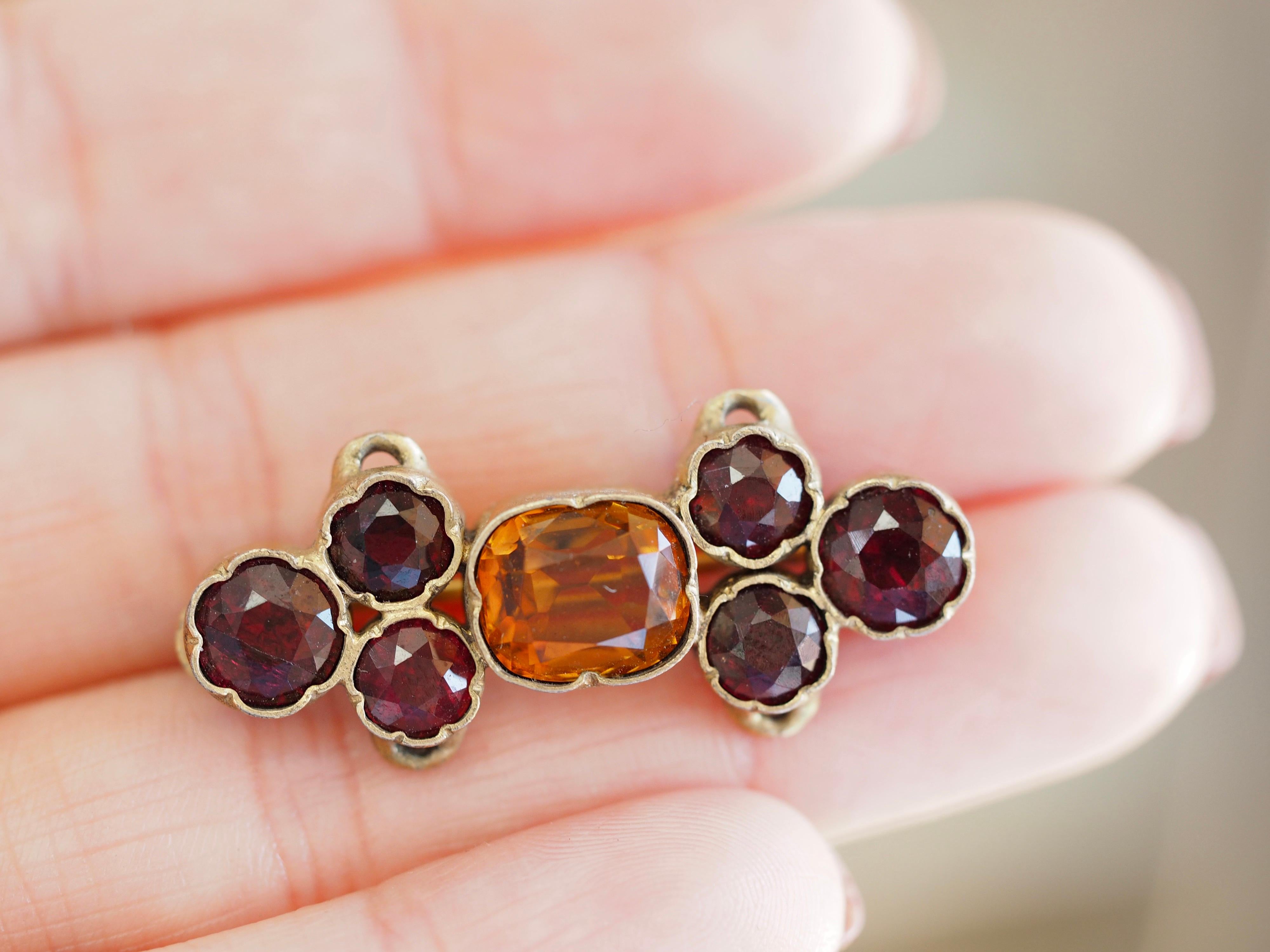 This beautiful Retro brooch can also be converted into a sliding pendant through it's little loops on all 4 corners, so versatile! It boasts vibrant colors in a lovely oval shaped natural citrine stone nestled in the middle of 6 round natural