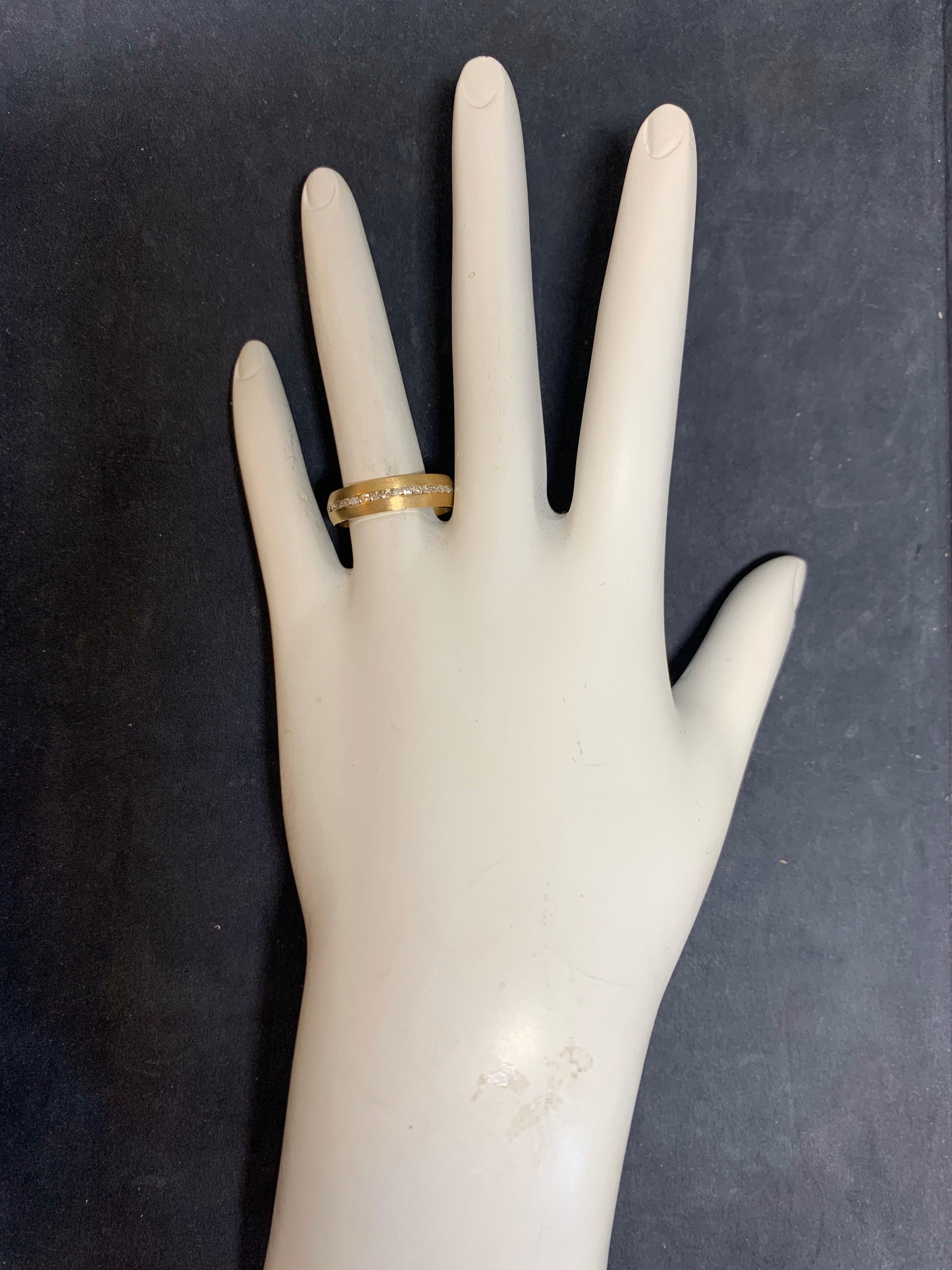 Retro Yellow Gold Ring,  0.75 Carats of 39 Natural G-I color,  SI clarity Round Brilliant Diamonds. Weight is approximate.

The ring is 3.9 grams and is a size 6.5. The band width is 5mm.
 
Circa 1950. Condition is Pre-owned. (stock#B344)