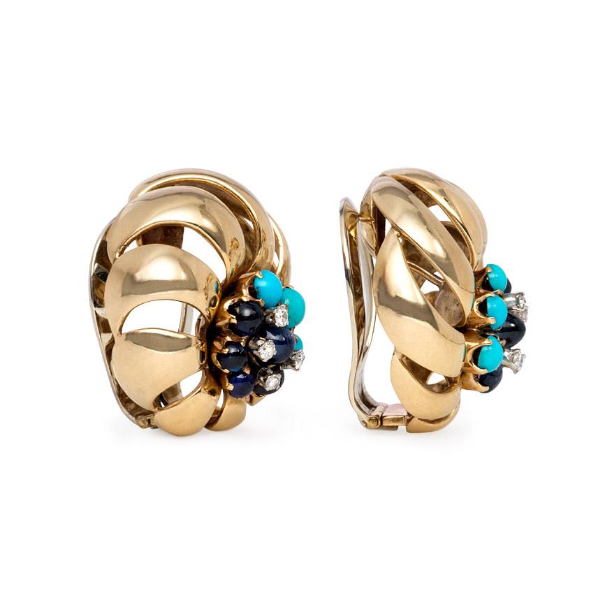 A pair of Retro gold clip earrings of open swirled design with turquoise, diamond, and sapphire clusters, in 18k.
