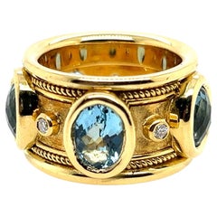 Bague cocktail rétro signée Christoff, avec topaze bleue naturelle suisse et diamants