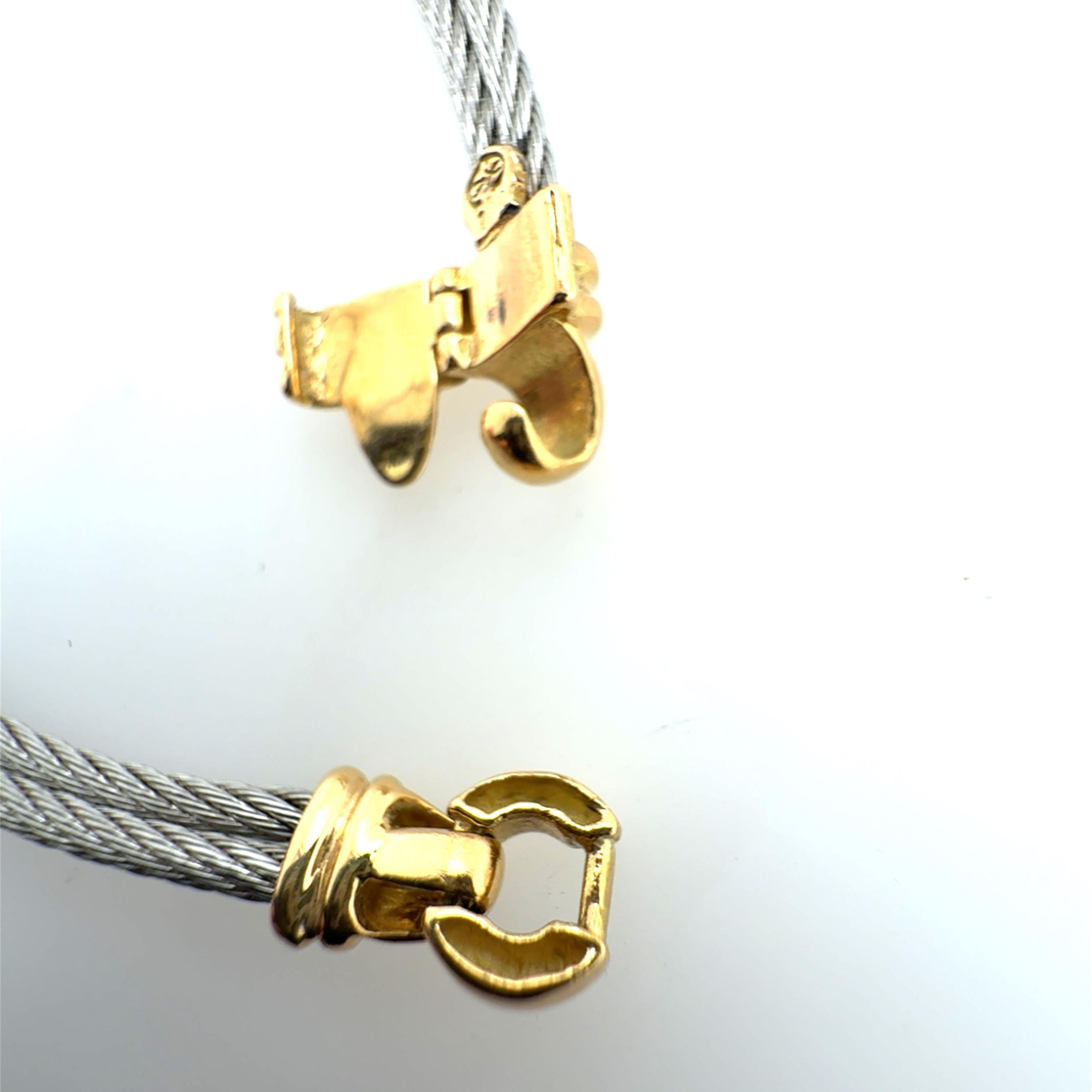 Retro 18K yellow gold and steel statement necklace set with 30 natural round brilliant diamonds weighing approximately 0.60 carats total. The necklace measures 16.25 inches in length and weighs approximately 29.3 grams. Stamped with a hallmark