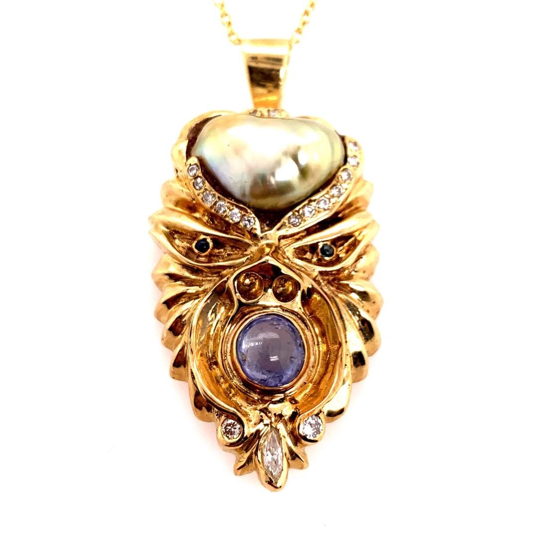 Round Cut Retro Gold Warrior Head Natural Pearl, .30 Carat Diamond & Sapphire Pendant 1950 For Sale