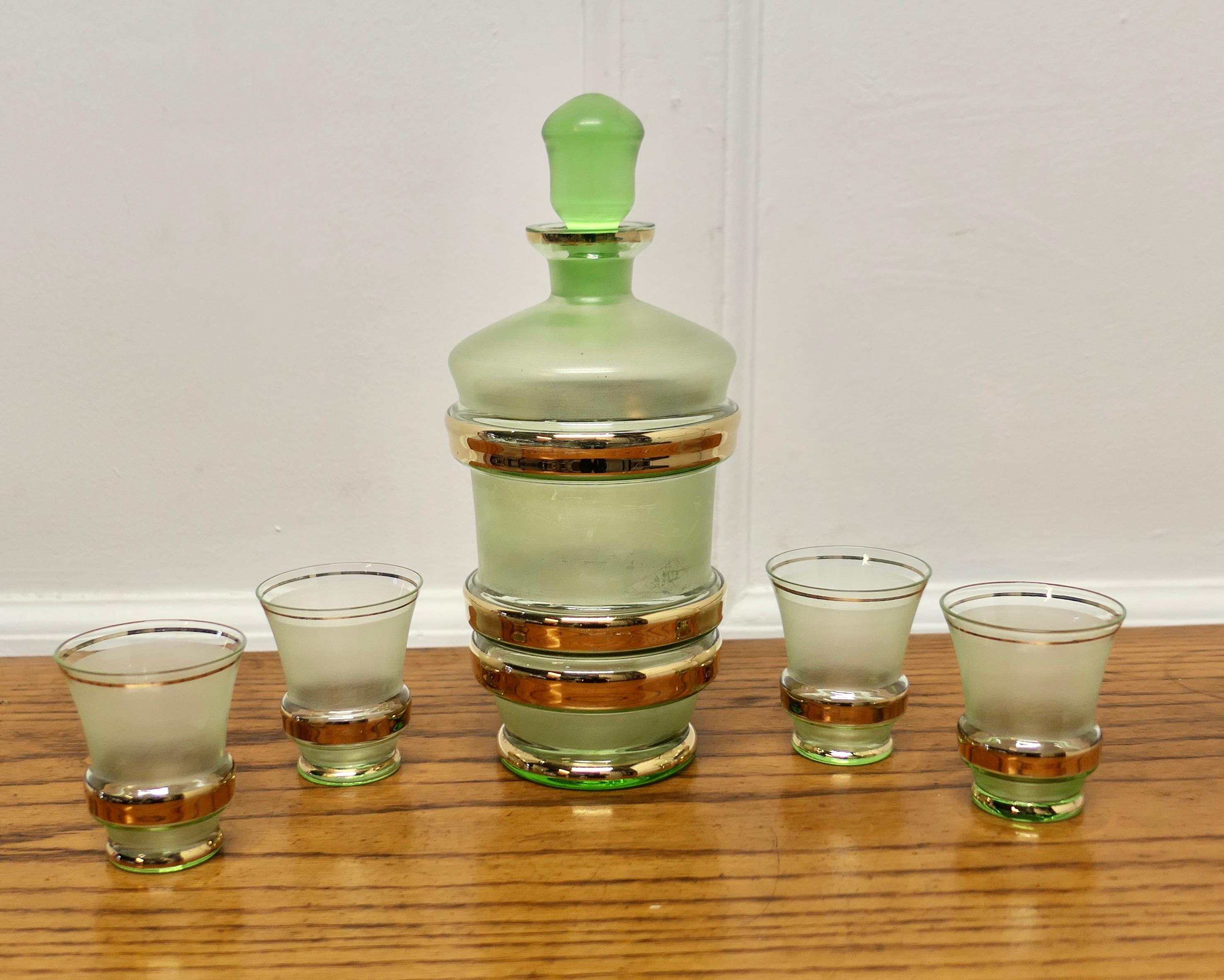 Retro Green and Gold Glass Sherry Decanter and 4 Glasses  

Undoubtedly Retro chic, a beautiful Green and Gold Sherry Decanter with 4 matching Schooners
All in good condition the Decanter is 10” tall and 5” in diameter 
TVY148