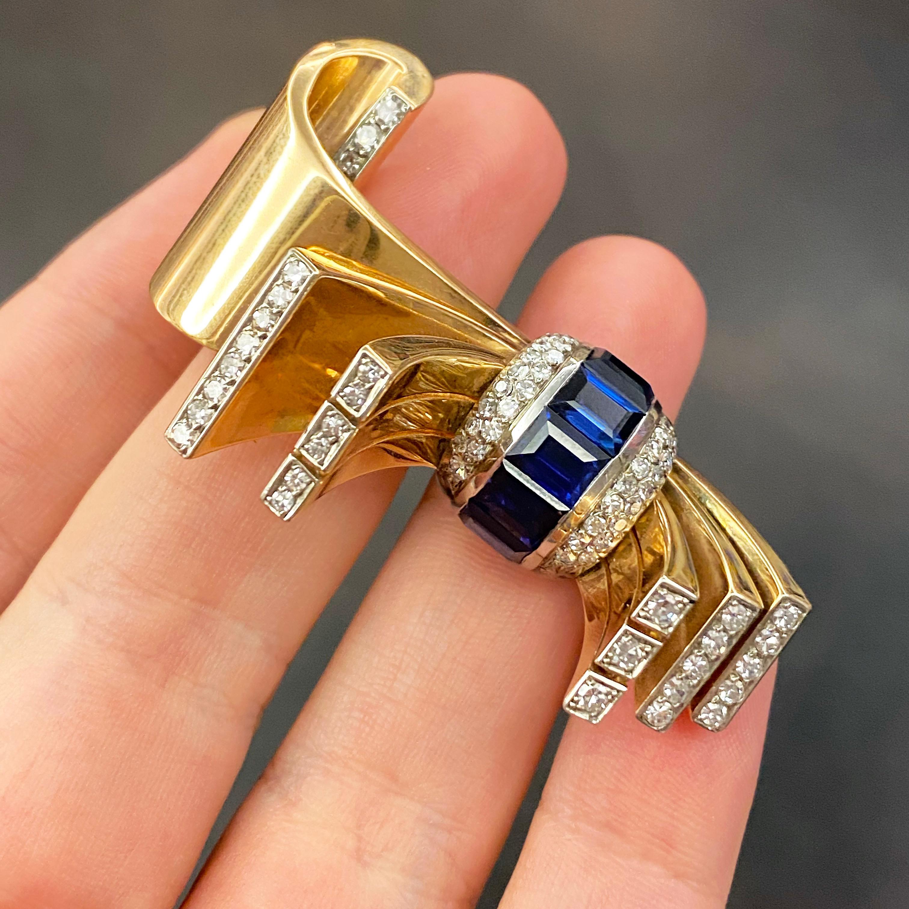 Women's or Men's Retro Gübelin Gold, Diamond, and Sapphire Clip Brooch of Stylized Bow Design For Sale