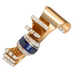 Retro Gübelin Gold, Diamond, and Sapphire Clip Brooch of Stylized Bow Design