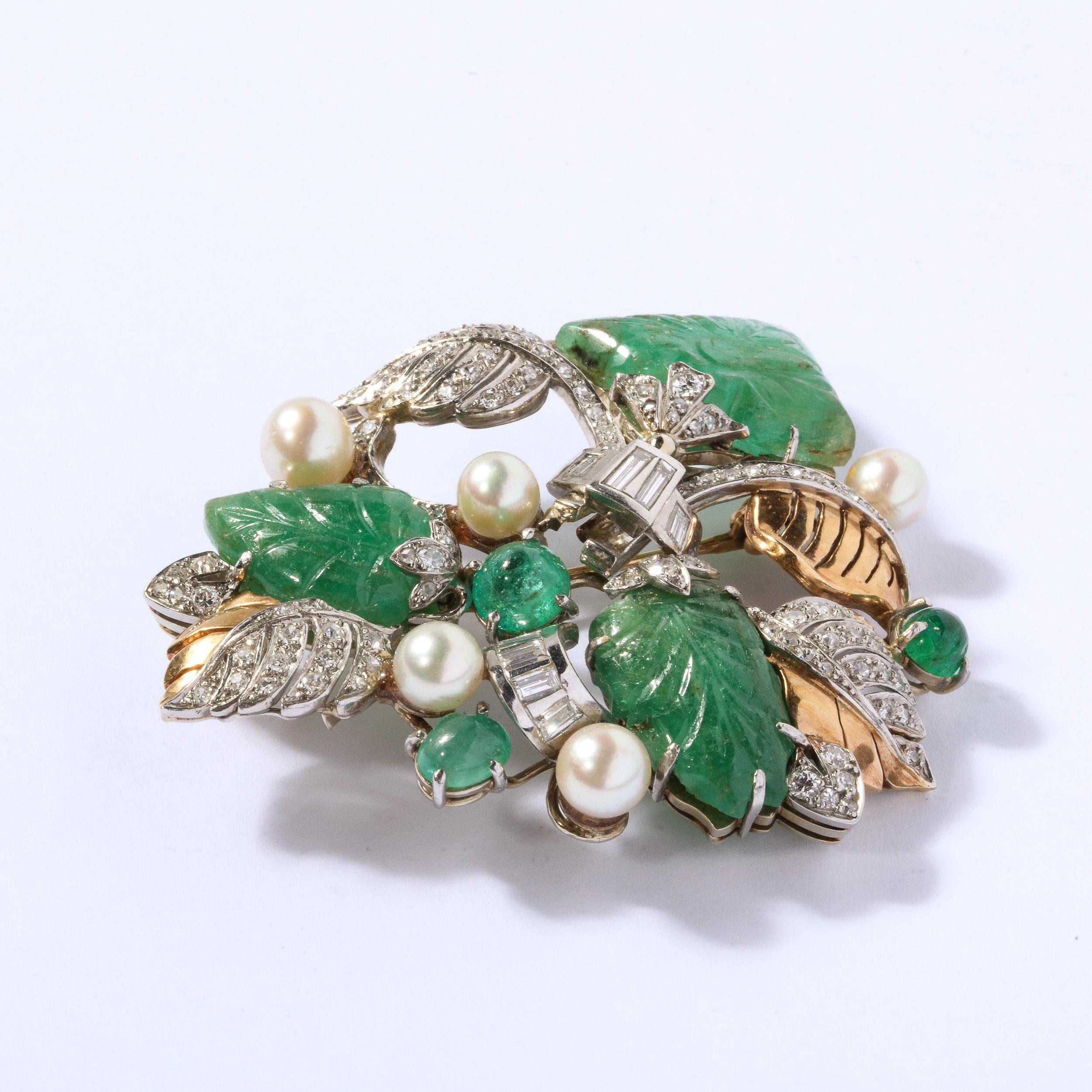 This exquisite brooch features a stylized Retro foliage and scroll design set with leaf design elements set with hand carved emeralds The diamonds are baguette and round cut of approximately 2.5 carats .This bracelet is also accented with 5 fine