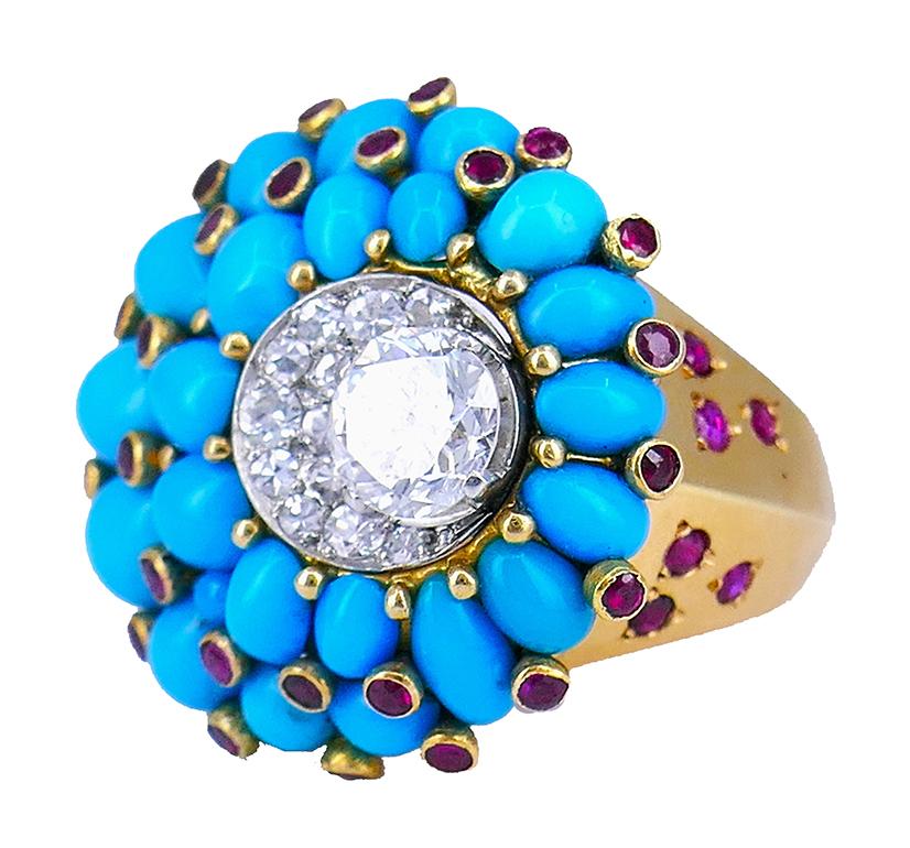 An exuberant turquoise ring with diamond and ruby; signed by Horovitz. 
The head of the ring is crafted of turquoise cabochons mounted in a spiral pattern. The center of the spiral is a “crater” encrusted with Old European cut diamond, single cut