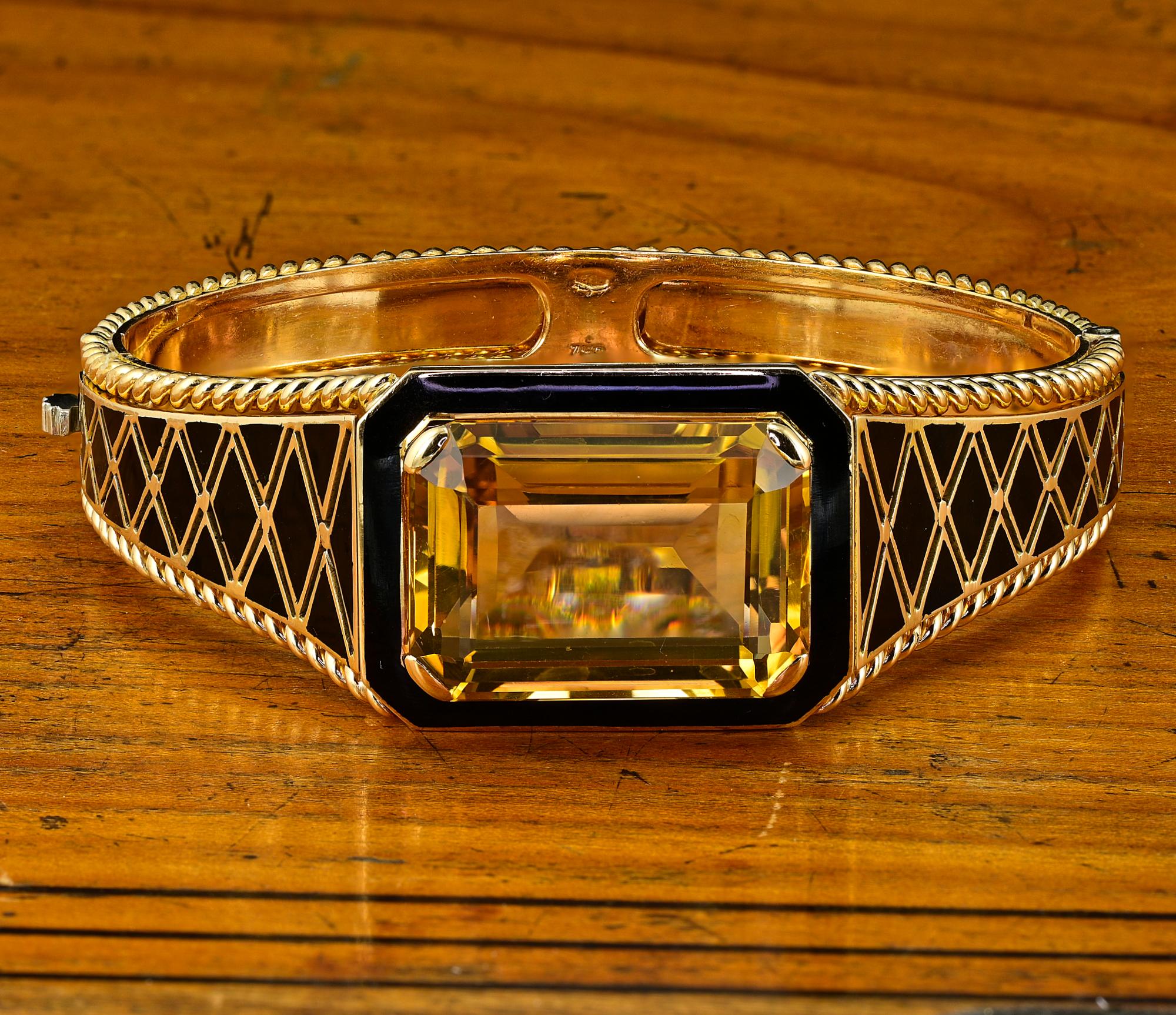 This stunning Retro period bangle is 1935 circa, bearing Italian Stamps for the period
Majestic hand workmanship made of solid 18 KT, weighs 61.4 grams
It faces up with the center natural Citrine which is a known weight of 33.80 Ct. (23.34 x 17.63