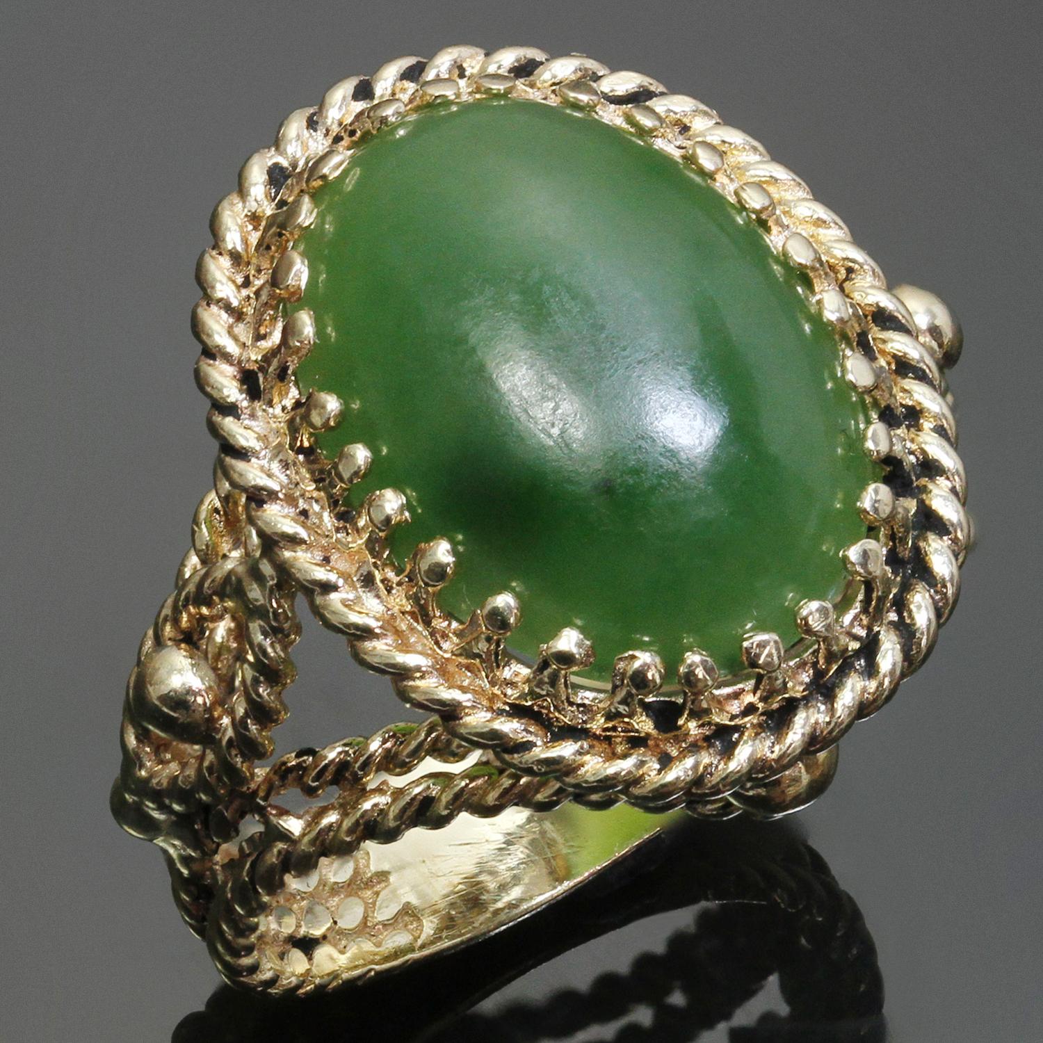 This classic retro estate cocktail ring features a braided design hand-crafted in 14k yellow gold and set with an oval green jade stone. Made in United States circa 1950s. Measurements: 0.86