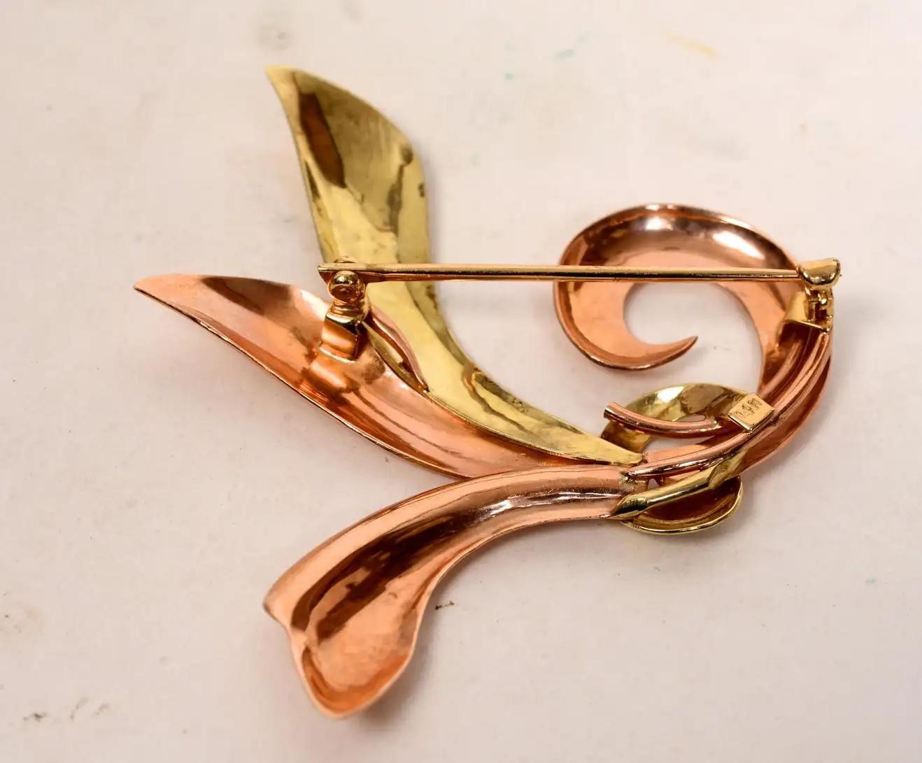 Retro Leaf Pin in 14K Rose and Yellow Gold. A Vintage two-tone rose and yellow gold brooch. This beautiful pin is very wearable for either dressing up or down. The 14K gold leaves are joined together and held by a loop. This brooch closes with a 
