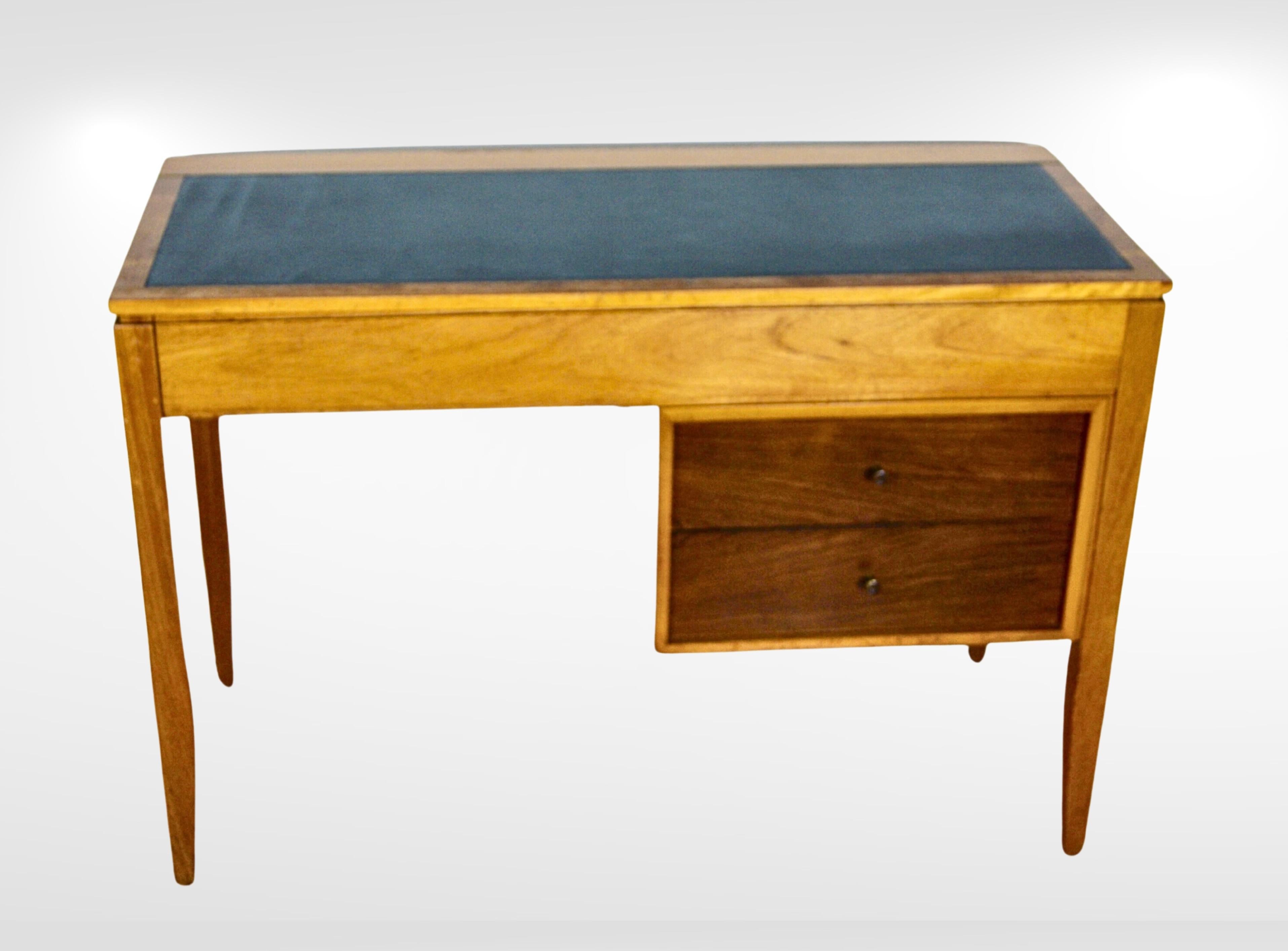 Mid-century two tone walnut and leather flip top desk/dresser.
Designed by Peter Hayward as part of the M' range for UNIFLEX Furniture GB, circa 1950.
This UNIFLEX wood and leather desk is representative of the design trends in compact and multi use
