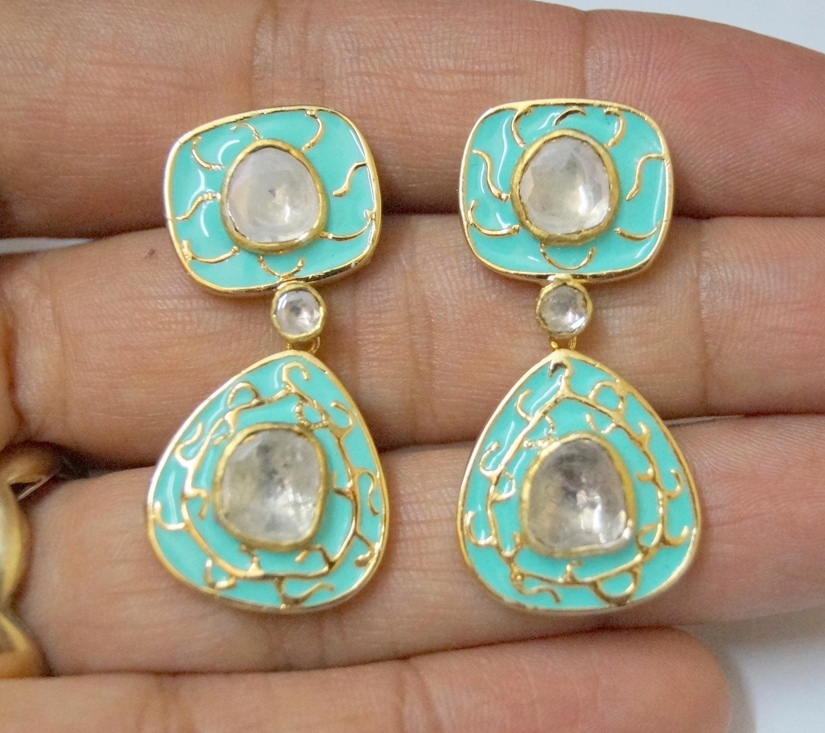 Elegant turquoise enamel with gold makes these earrings perfect for the day party as well as dinner date.  Impressive bright uncut diamonds adds to the brilliance yet give it a subtle look. This is a perfect pair of diamond earrings in sterling