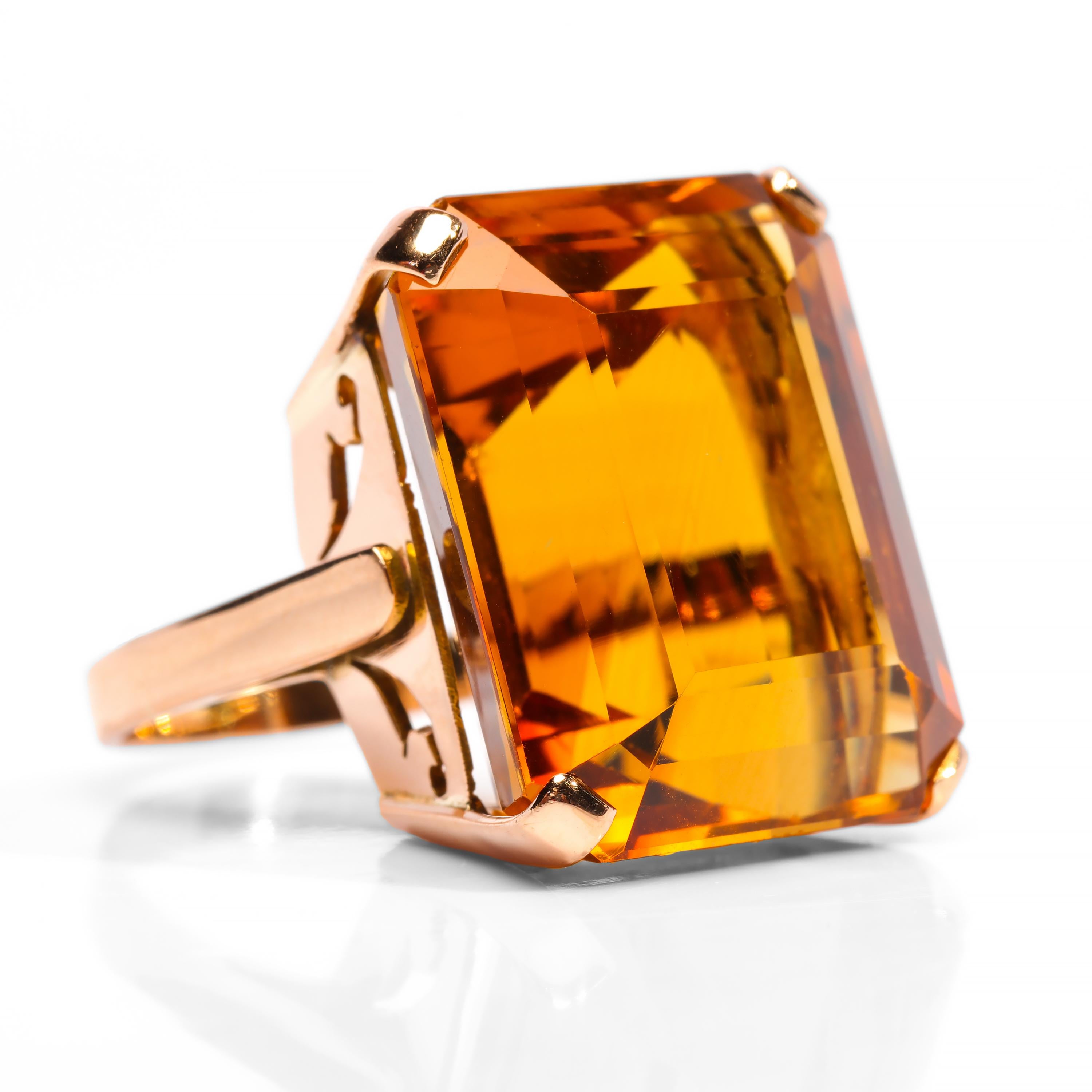 A 33.44-carat emerald-cut Madeira citrine with depth, fire, smoldering intensity, and just plain old-school 