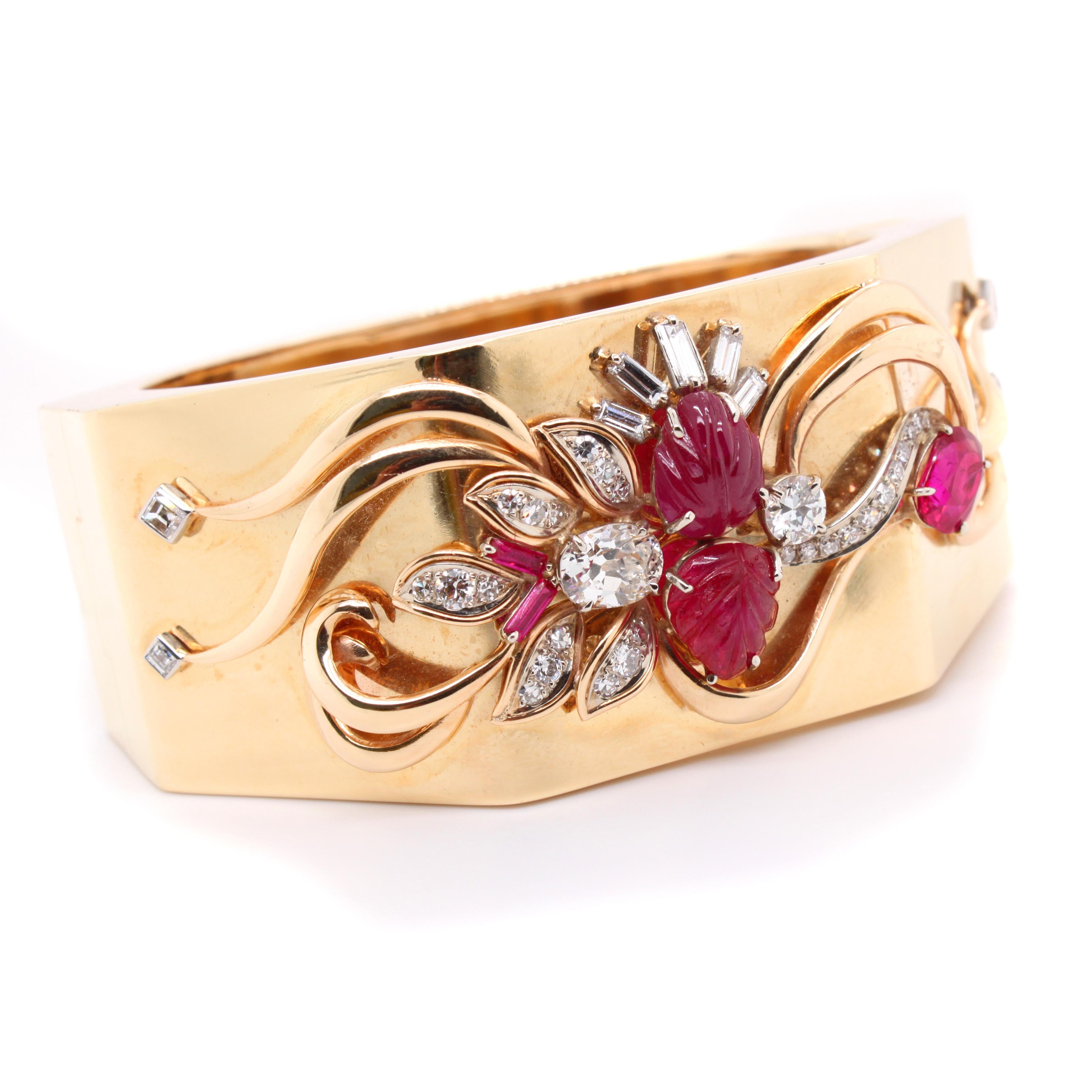 Retro Trabert & Hoeffer Mauboussin Ruby and Diamond Gold Bangle, ca. 1940s

An iconic gold bangle by the French-American jeweller Trabert Hoeffer & Mauboussin, from the 1940s. The bangle has a bold octagon design and features a floral design with