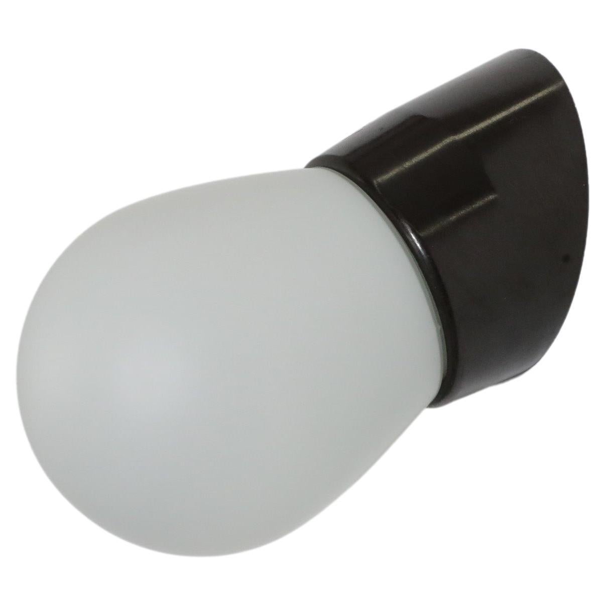 Retro Mid-Century Frosted Bulbous Glass Sconce with Angled Black Bakelite Base For Sale