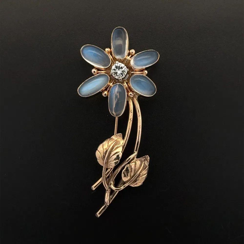 Simply Beautiful! Stylish and finely detailed Retro Oval Moonstone and Diamond Mid Century Modern Brooch. Hand set with Oval Moonstone, weighing approx. 12tcw and Diamonds, approx. 0.50tcw. Pin measures approx. 2.4” High. Beautifully Hand crafted in