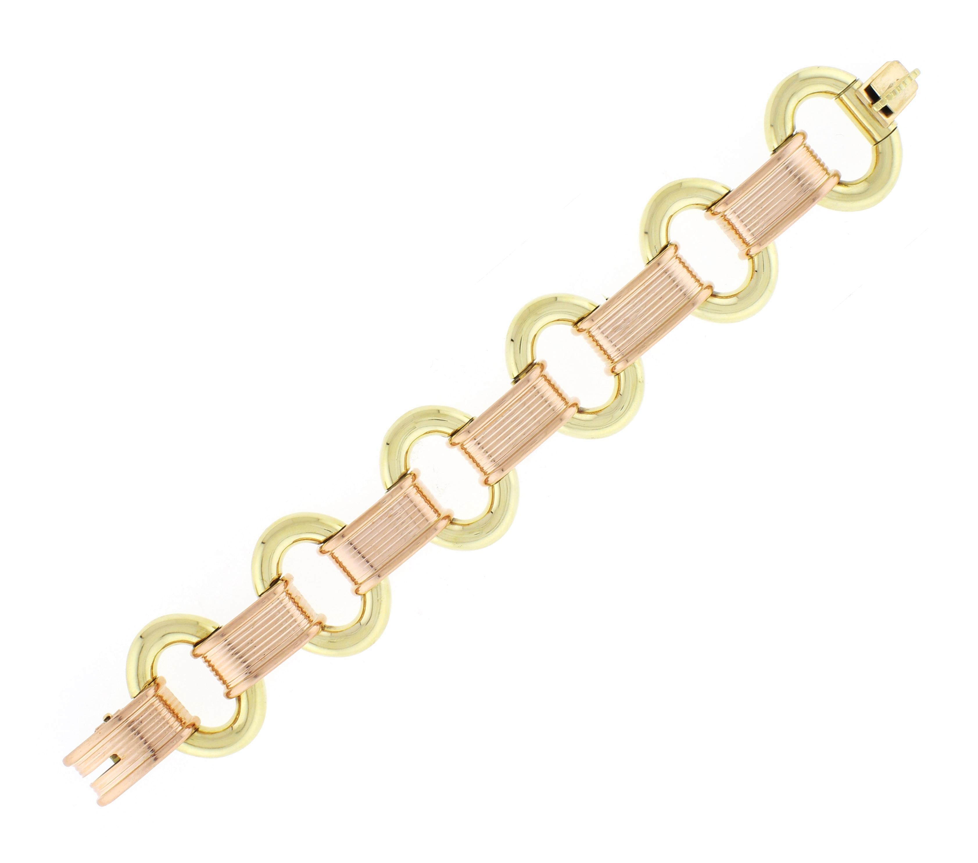 From the fabulous style of the late 1940s retro-modern period, this pink and yellow 14 karat gold bracelet. The bracelet is 1 ¼ inches wide and 7 ¾ long  68.1 grams. The bracelet is in near perfect condition
