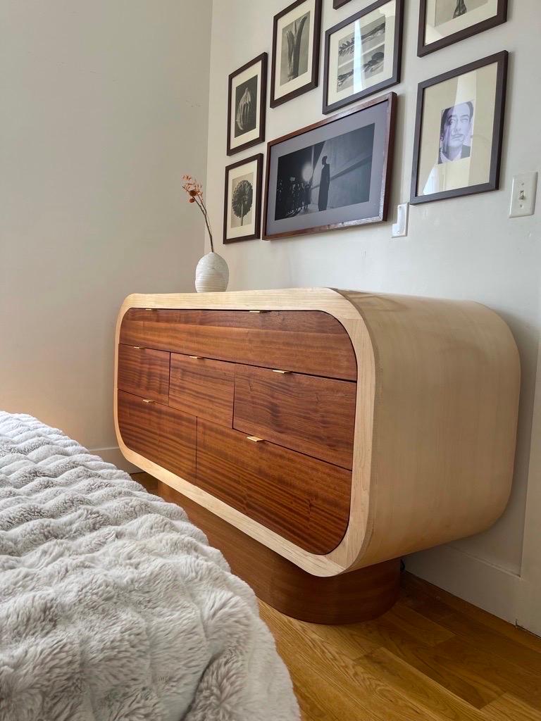 Thank you for visiting my store! 

Made from solid mahogany and maple adds a striking stand out element to any bedroom. I take my design inspiration from my environment, media, art, and my imagination. As a child, I loved watching reruns of The