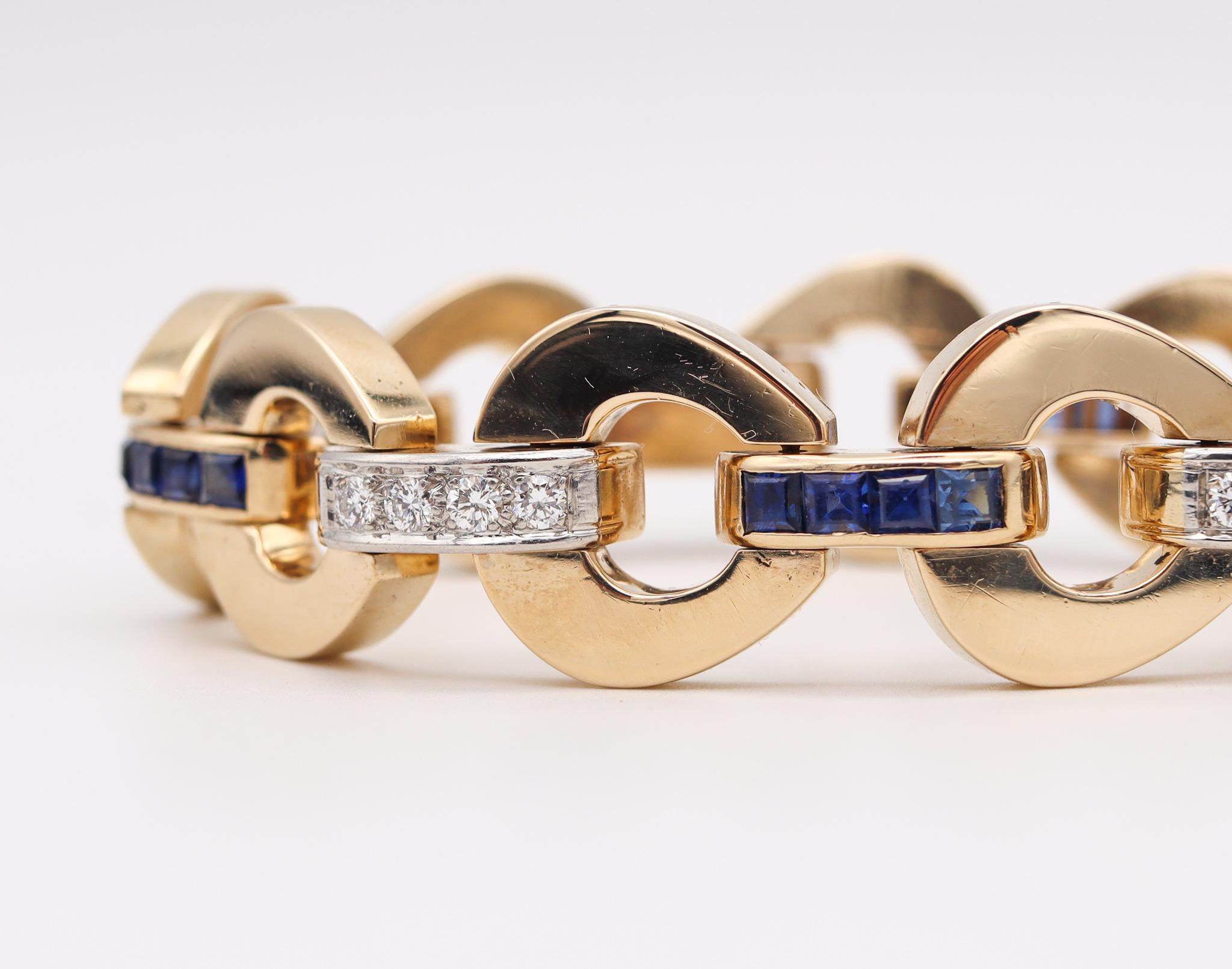 Retro modernist bracelet with gemstones.

Beautiful, bold and substantial bracelet crafted during the late mid century period back in the 1960. This piece has been made in solid yellow gold of 14 karats with high polished finish and is accented with