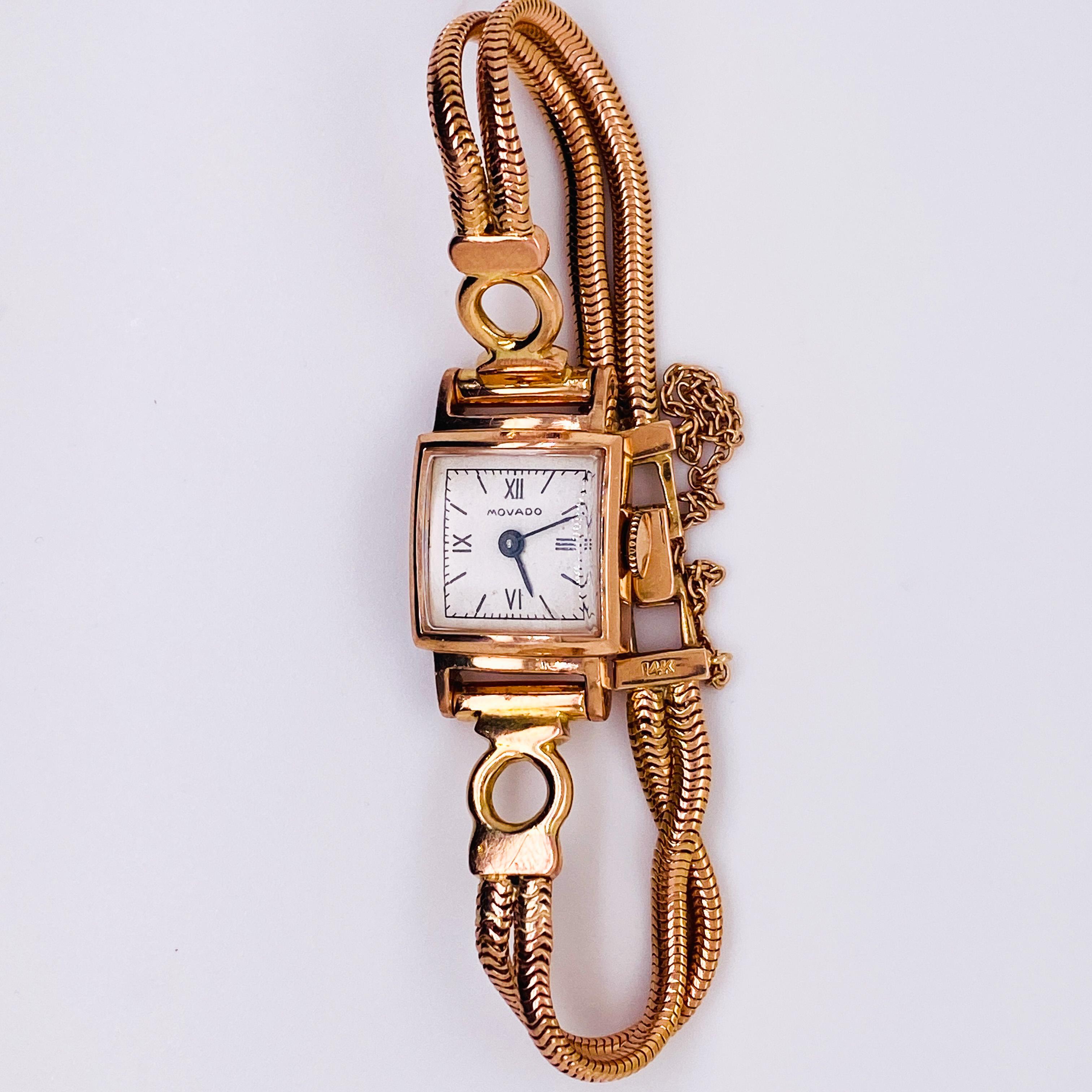 Movado has been making watches since 1881 and this vintage watch is Circa 1954. The solid 14 karat rose gold is gorgeous and very Retro. The band is fitted for a small wrist and includes a 14 karat rose gold safety chain. The square shape of the