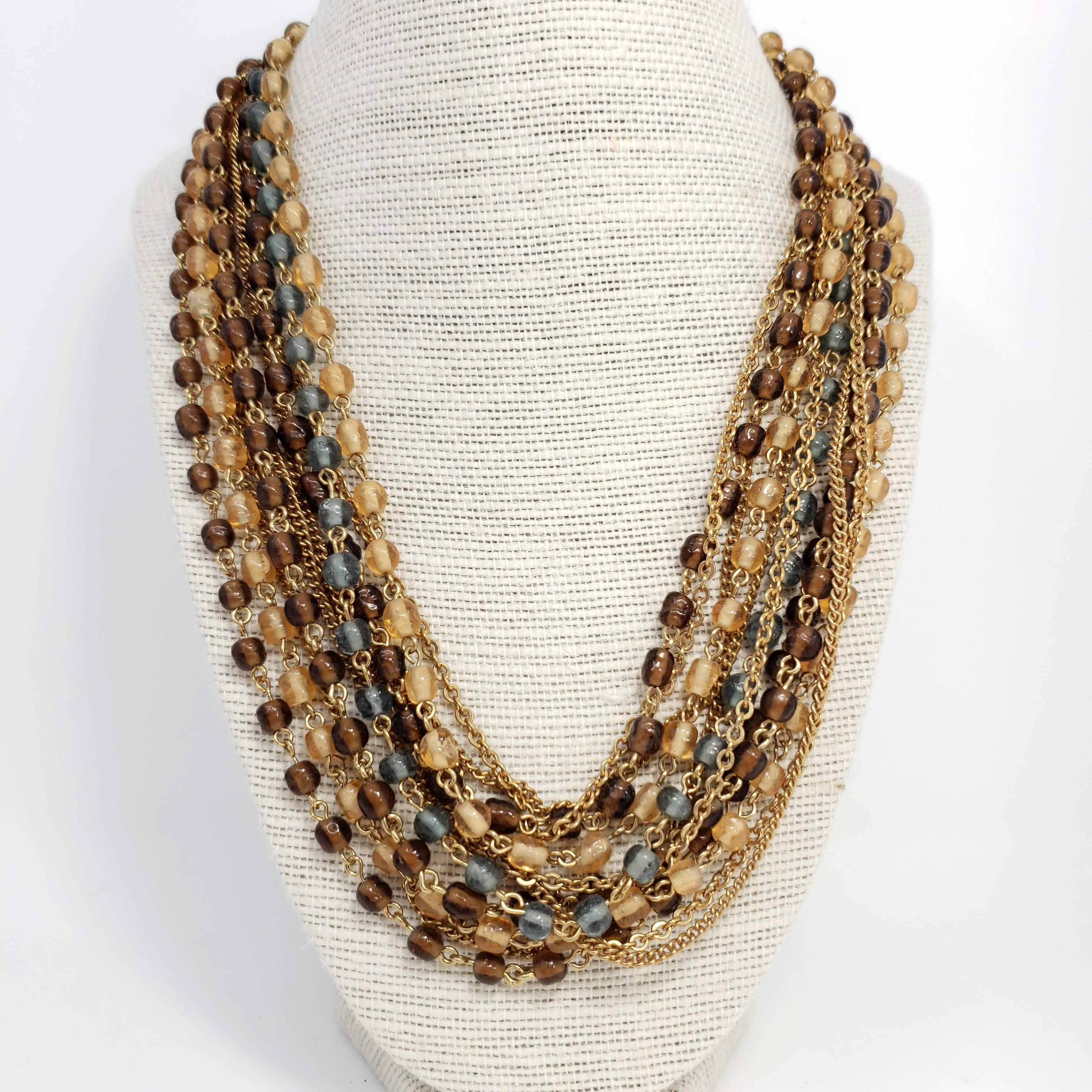 Multi-strand retro necklace with topaz & gray crystals and golden chains for a sophisticated golden glow!