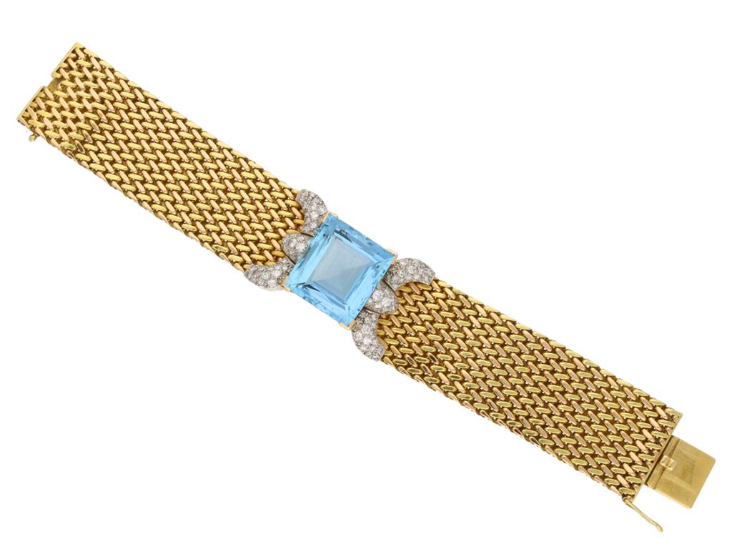 Aquamarine and diamond bracelet. Set to centre with a natural unenhanced square step-cut aquamarine with an approximate weight of 30.00 carats, flanked to either side by curved pavé set diamond panel, seventy-eight stones with an approximate total