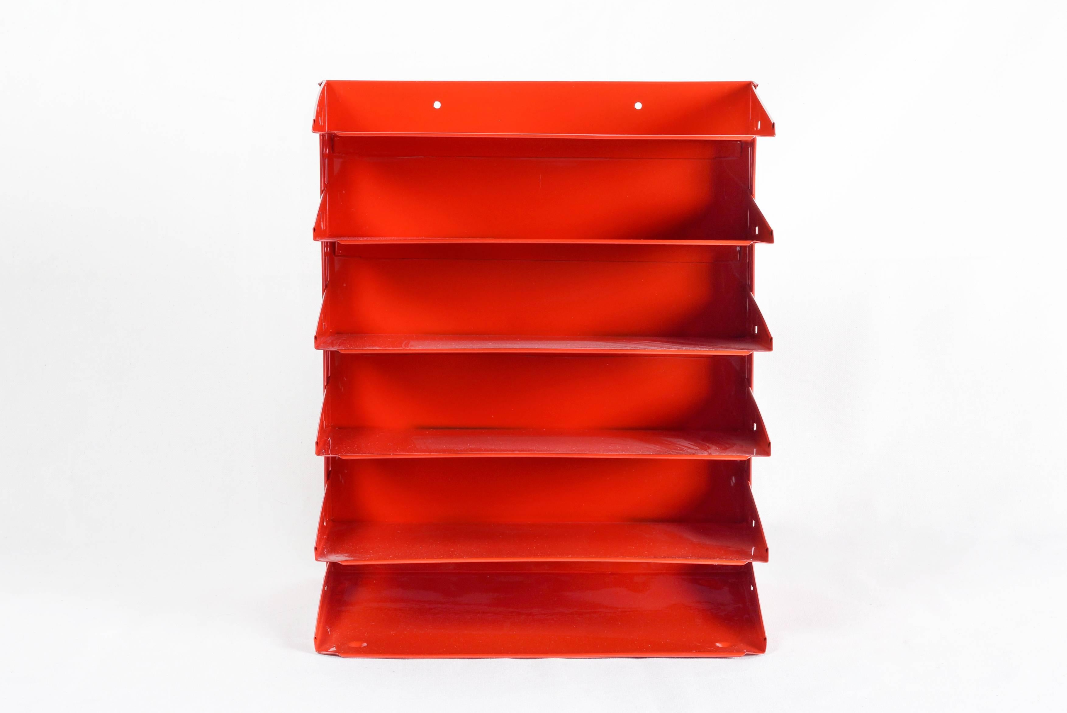 1970s retro office organizer refinished fire engine red. This iconic accessory is multifunctional, ideal for sorting mail, memos or magazines. Features six slots sure to keep your desk in tip-top shape. Easily wall-mounts.

Dimensions: 9