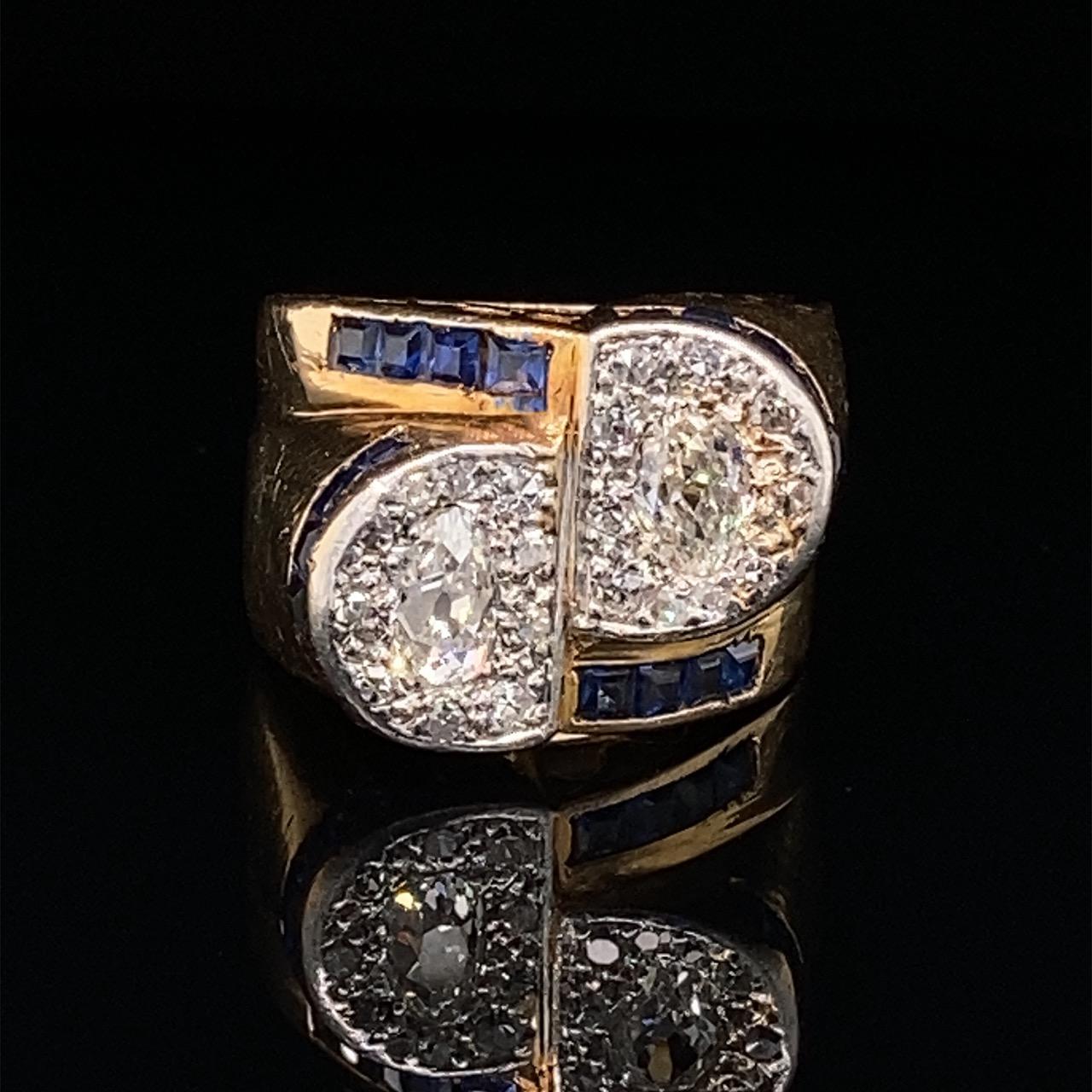Retro, Old Mine Diamond, Sapphire and Gold Toi-e-Moi Ring, French, ca. 1940s

An elegant Retro ring of beautiful cross-over design. The two semi-circles each set with a central old-mine pear-shaped diamond surrounded by pavé-set smaller diamonds,