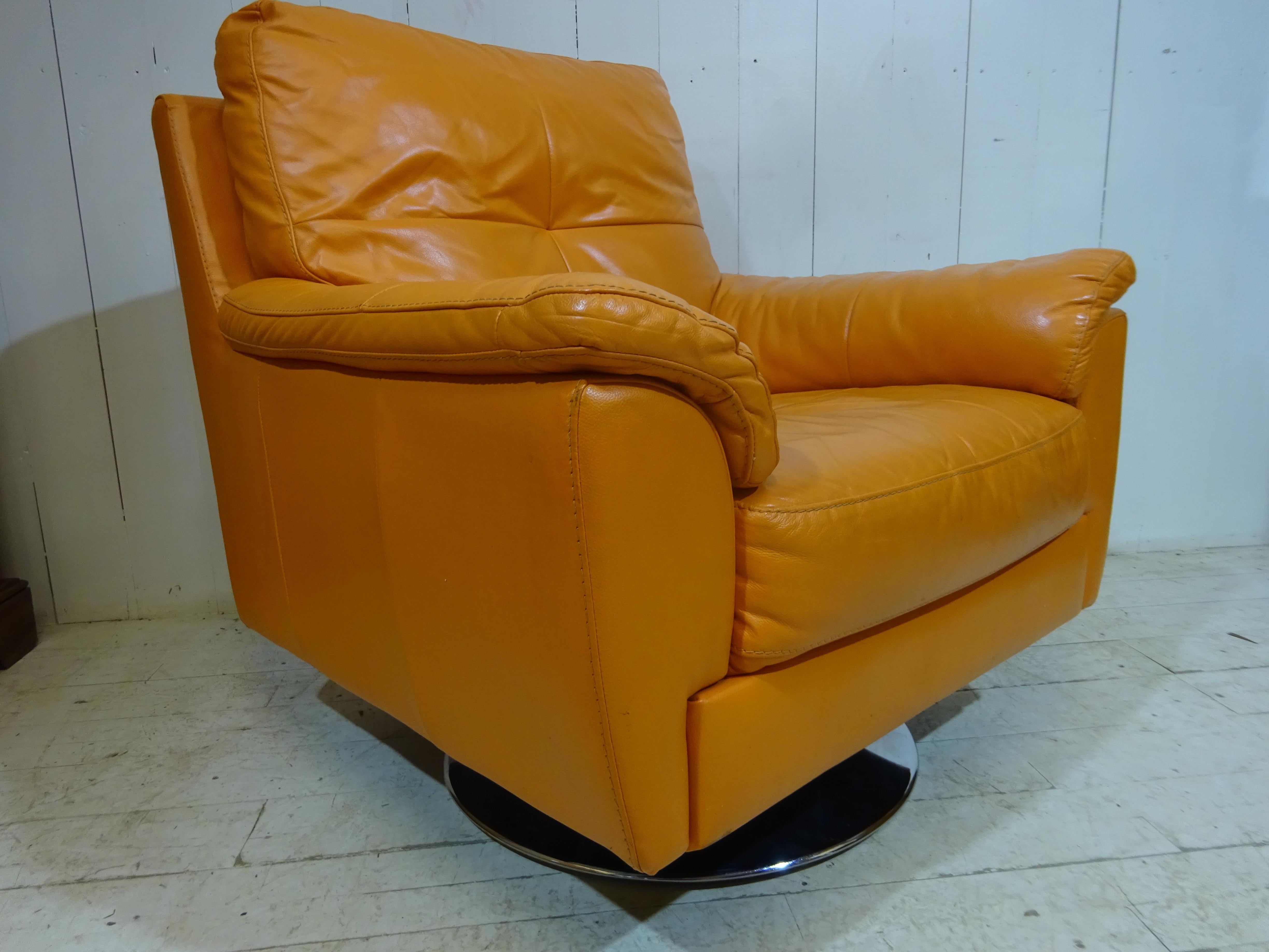 Great shape, looks and comfort all in one chair.

Dated circa mid 1980s this is a contemporary lounge swivel chair. Steel and chrome base offers a smooth swivel action whilst supporting the chair base. Chair frame is solid beech and steel covered