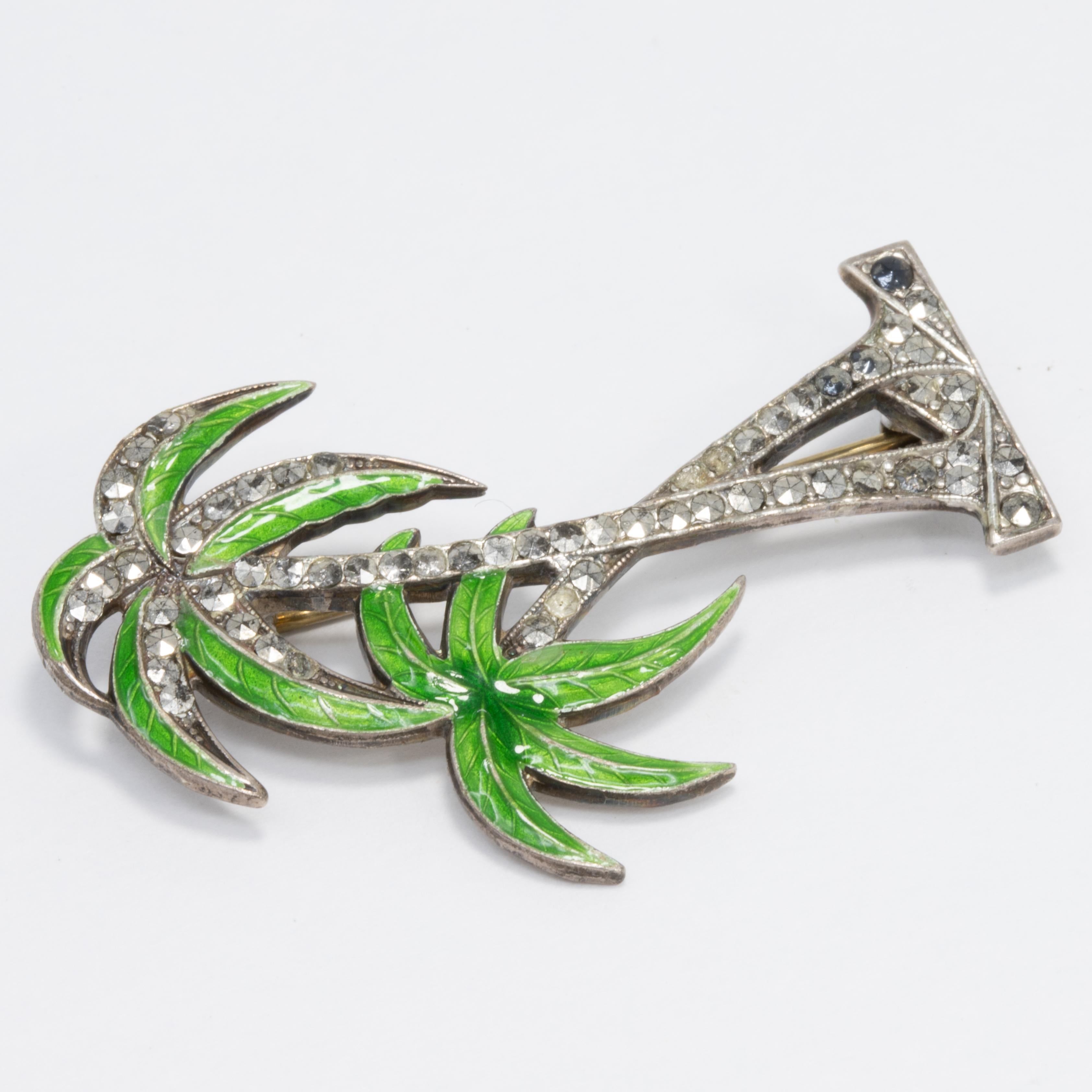 A stylish retro brooch, featuring two sterling silver palm trees painted with green enamel and decorated with marcasite crystals.

Marks / hallmarks: Sterling