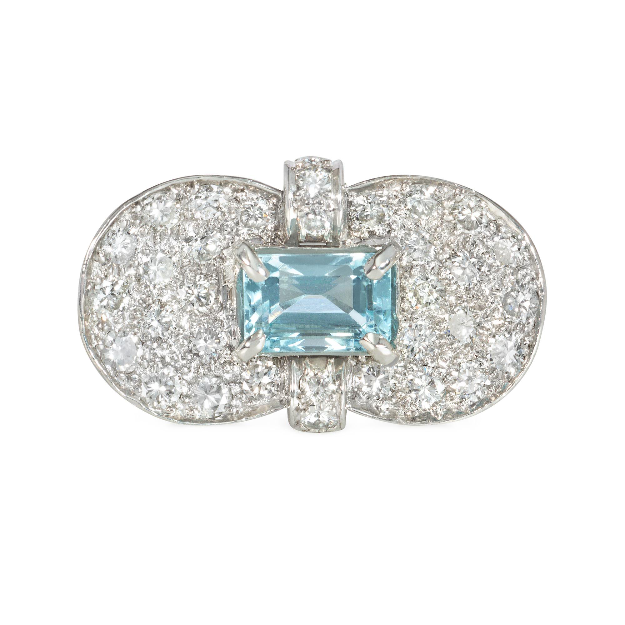 A Retro diamond and aquamarine ring designed as a concave pavé diamond girdled panel set with a central emerald-cut aquamarine, in platinum.  Numbered 1105.  Atw diamonds 1.60 cts., aquamarine measures approximately 7.5 x 5.5mm.