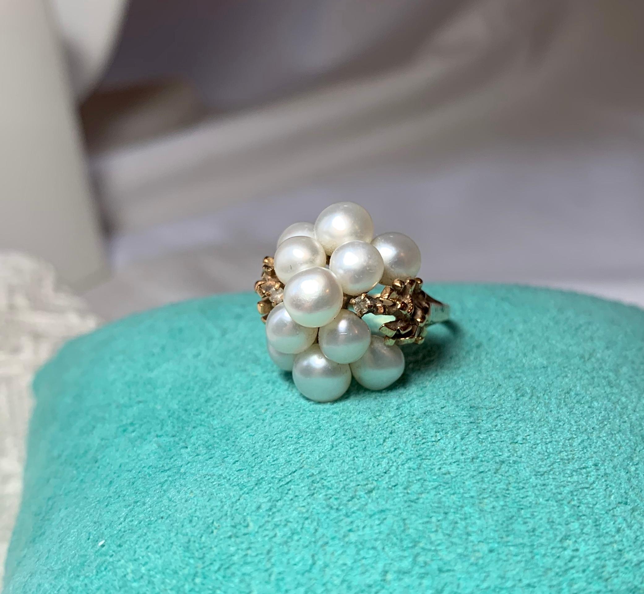 A stunning Pearl Cocktail Domed Fashion Ring in 14 Karat Yellow Gold.  This is such a scrumptious Retro Mid-Century Modern ring set with 11 glorious Pearls of five to six mm in length.  The pearls are piled up into a dome shape.  They are accented