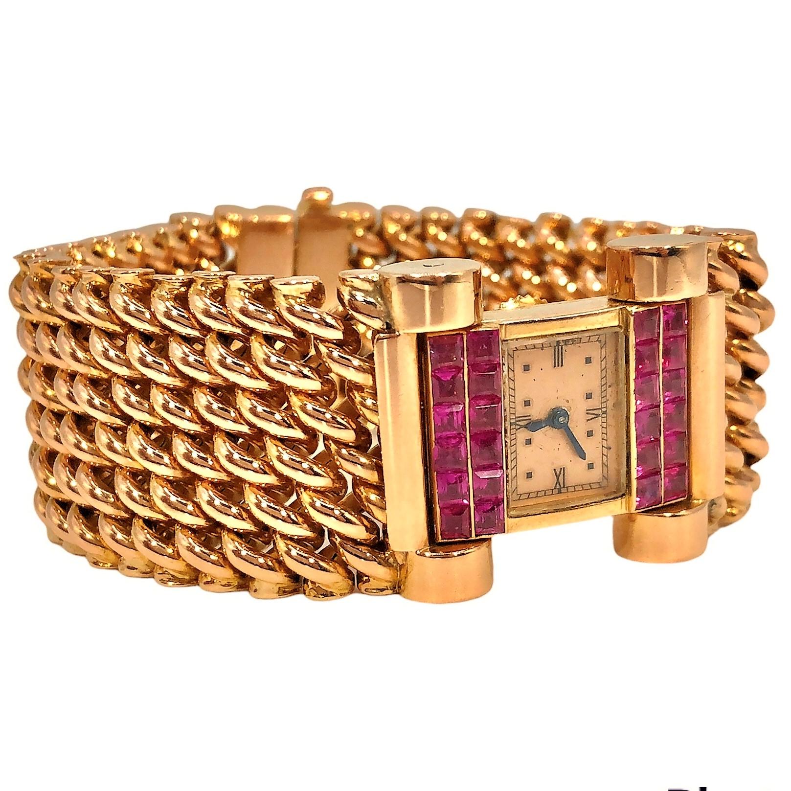 This very interesting Retro period wristwatch is crafted from 18k pink gold and natural square cut rubies. It is powered by a high grade, back wind, Jaeger LeCoultre movement. The rectangular watch head has a beautiful vintage condition pink gold