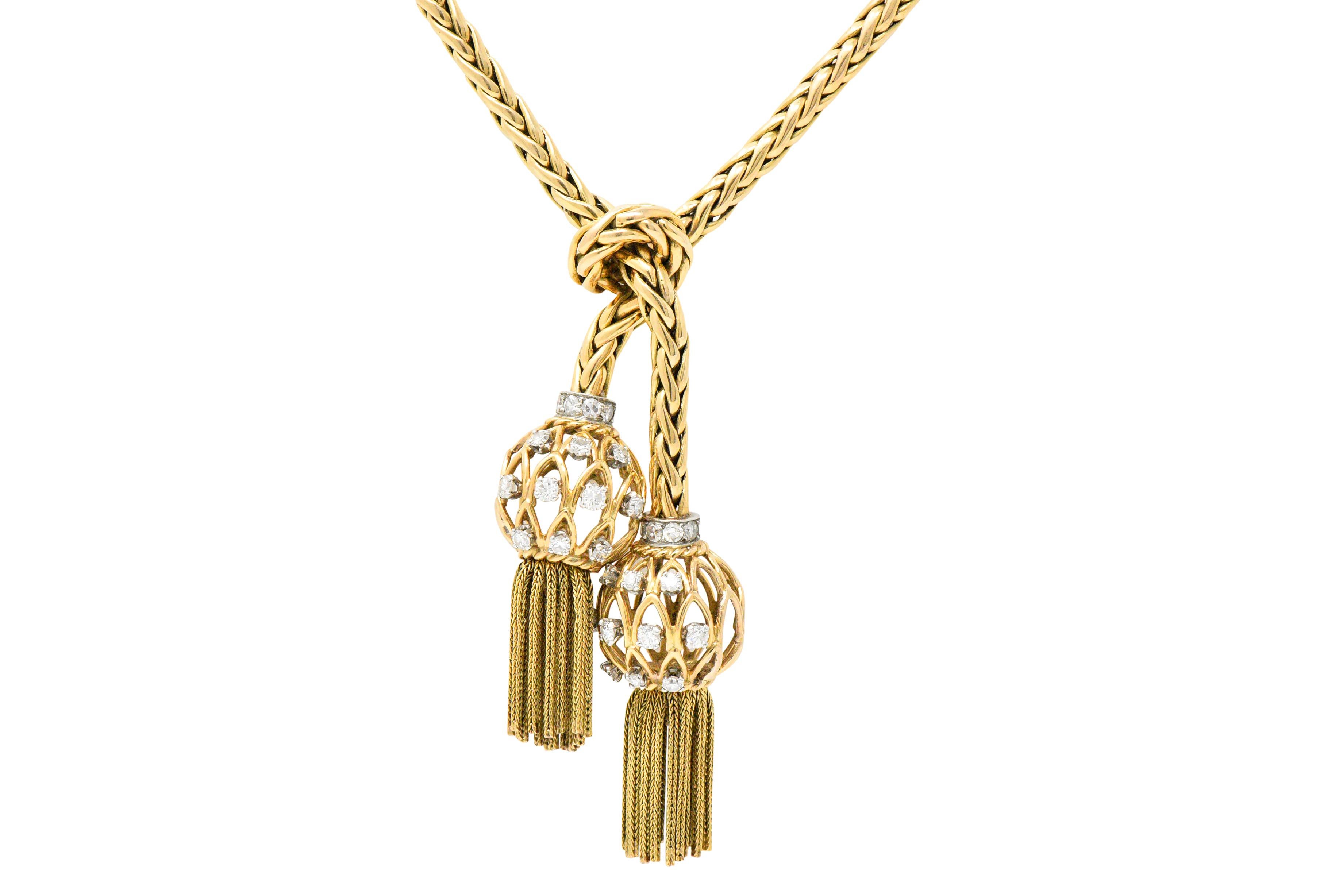 Retro Pierre Sterlé Diamond Platinum And 18 Karat Gold Tassel Necklace Paris

Designed as a woven rope style necklace knotted and terminating in open wire orbs with tassels

The open wire orbs are set with single and full cut diamonds, approximately