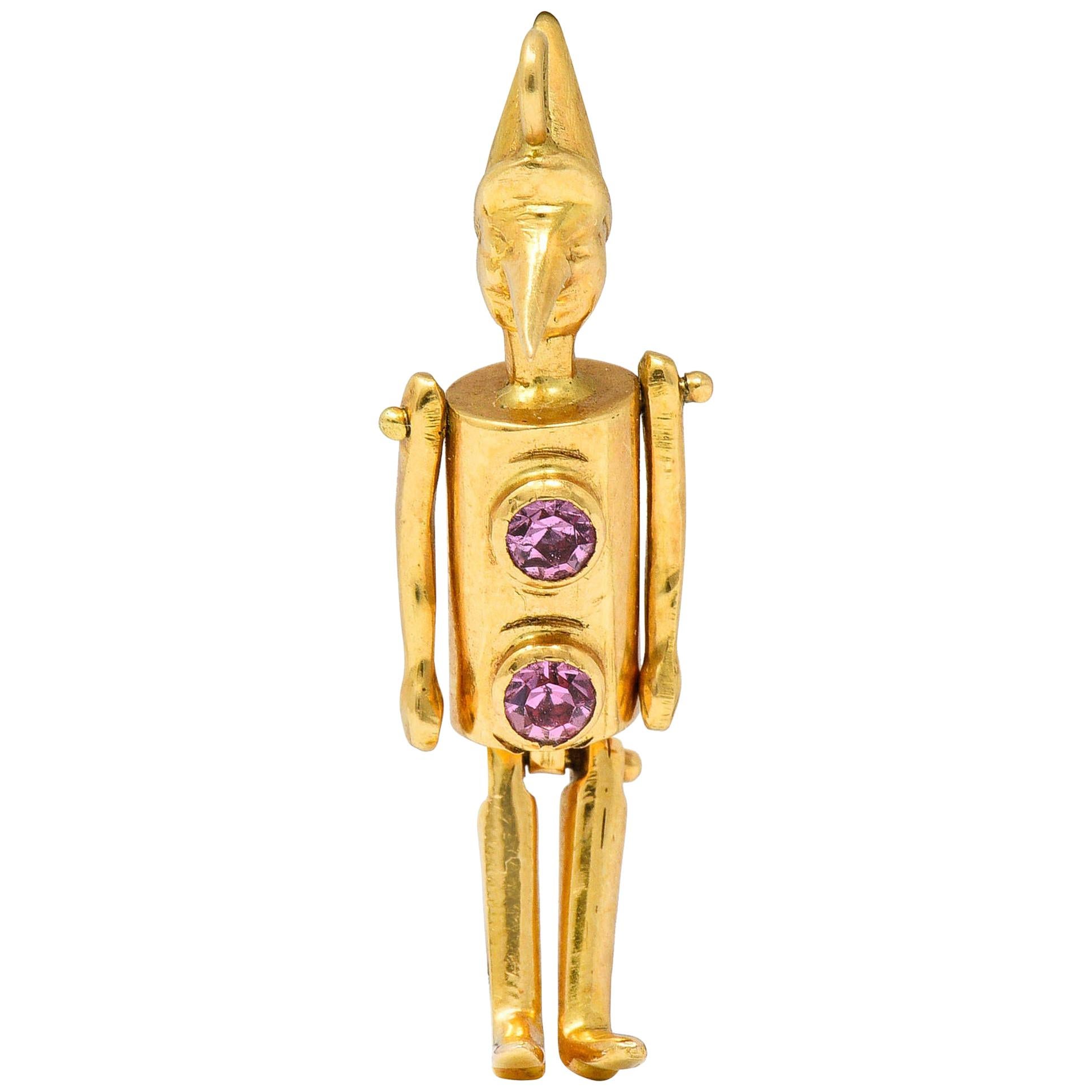 Retro Pink Sapphire 18 Karat Gold Articulated Pinocchio Charm