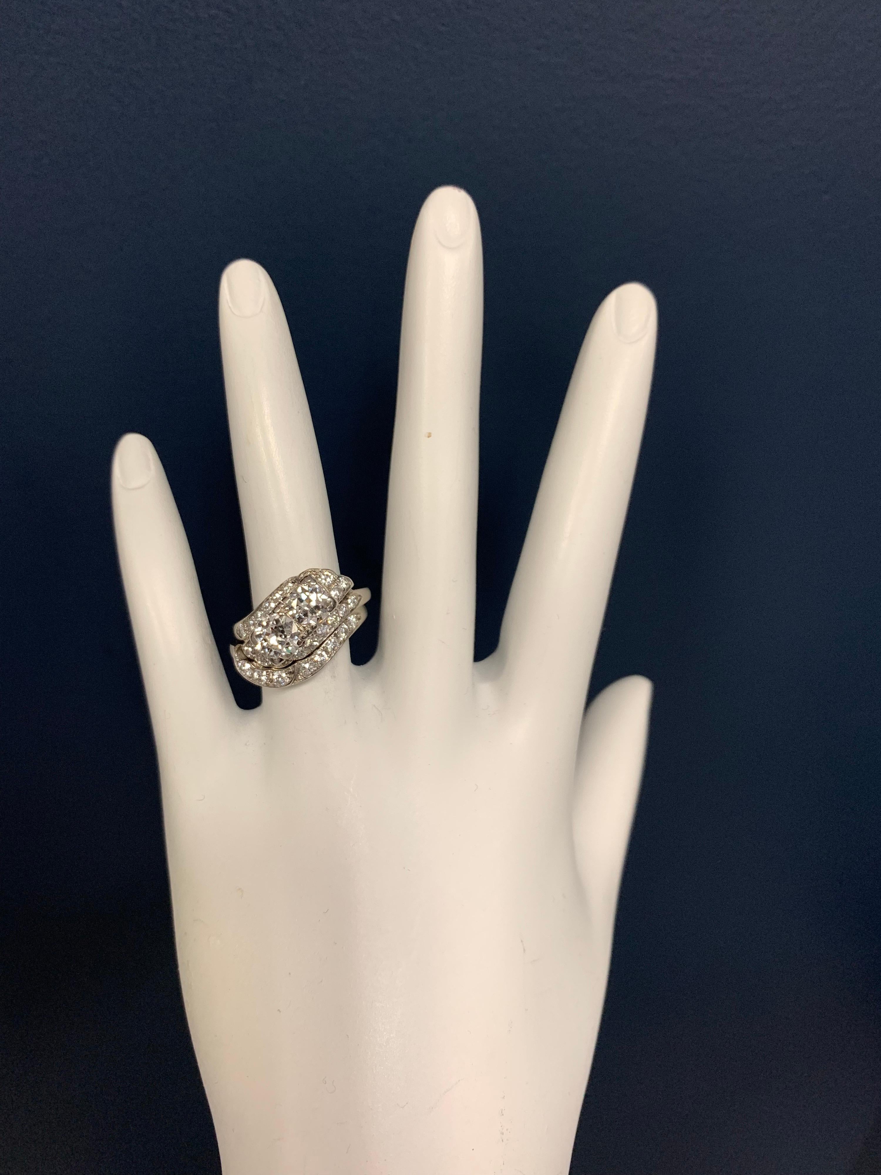 Vintage Platinum RING (size 5) set with two Old Mine Brilliant Natural Diamonds, one measuring approximately 5.5mm, 0.65cts and the second measuring approximately 6.1mm, 0.80cts. The stones are approximately H in color and VS in clarity. In addition