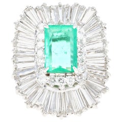 Retro Platinum 2.29 Carat Columbian Emerald and Diamond Ring