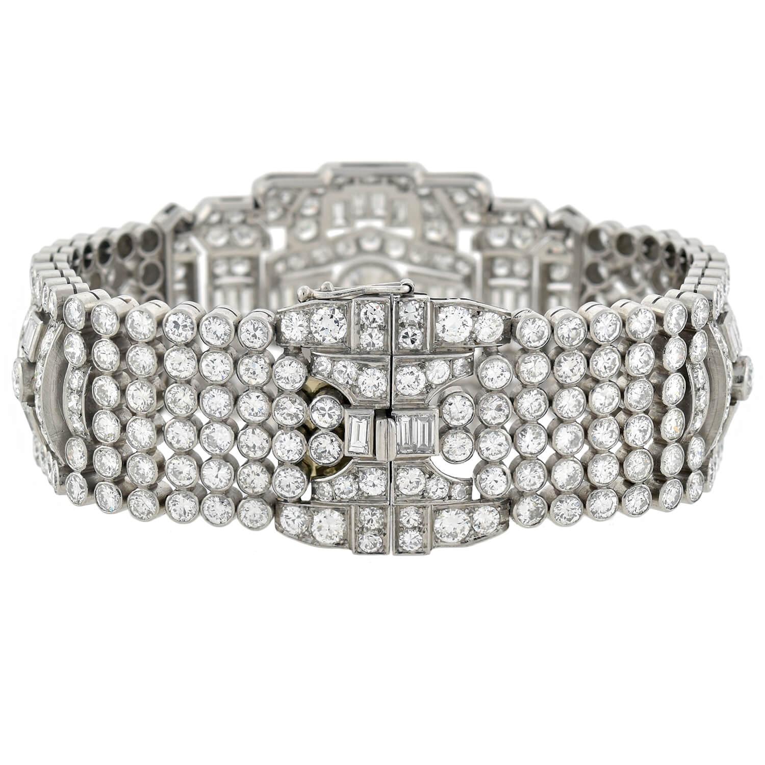 A Red Carpet worthy diamond encrusted bracelet from the Retro (ca1940) era! This absolutely exquisite piece is crafted in platinum and features a wide, flexible surface of diamond encrusted links, which interlock to form a fantastic and dramatic