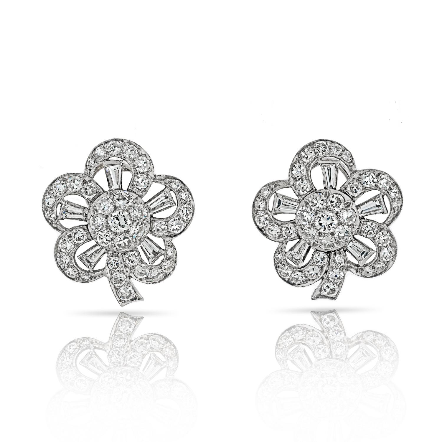Indulge in the timeless allure of these Retro Platinum Diamond Flower Clip Earrings—a captivating blend of vintage charm and sophisticated design. Skillfully crafted in platinum, these earrings showcase an arrangement of baguette and old-cut