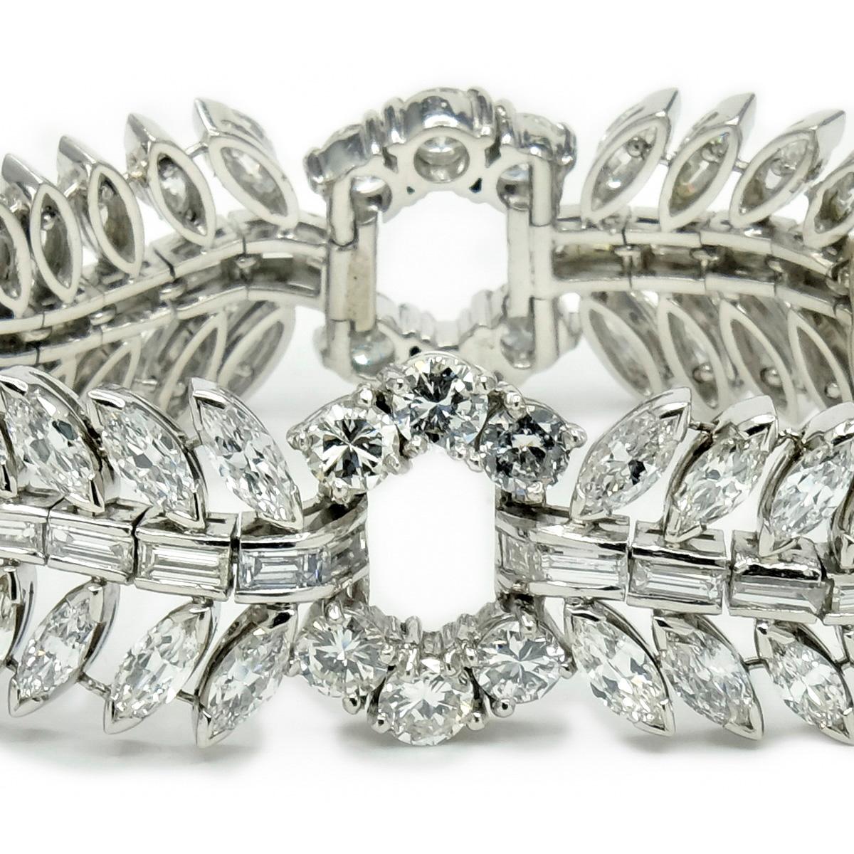 Period: Retro
Year: 1940s
Material: Platinum, 32cts Mixed Cut featuring Marquis and Baguette and Old European Cut Diamonds
Weight: 82.5 grams
Length: 17.78cm./7 inches
Width: 1.875cm./0.73 inches at Widest Point
Condition: Pristine Vintage, Handmade