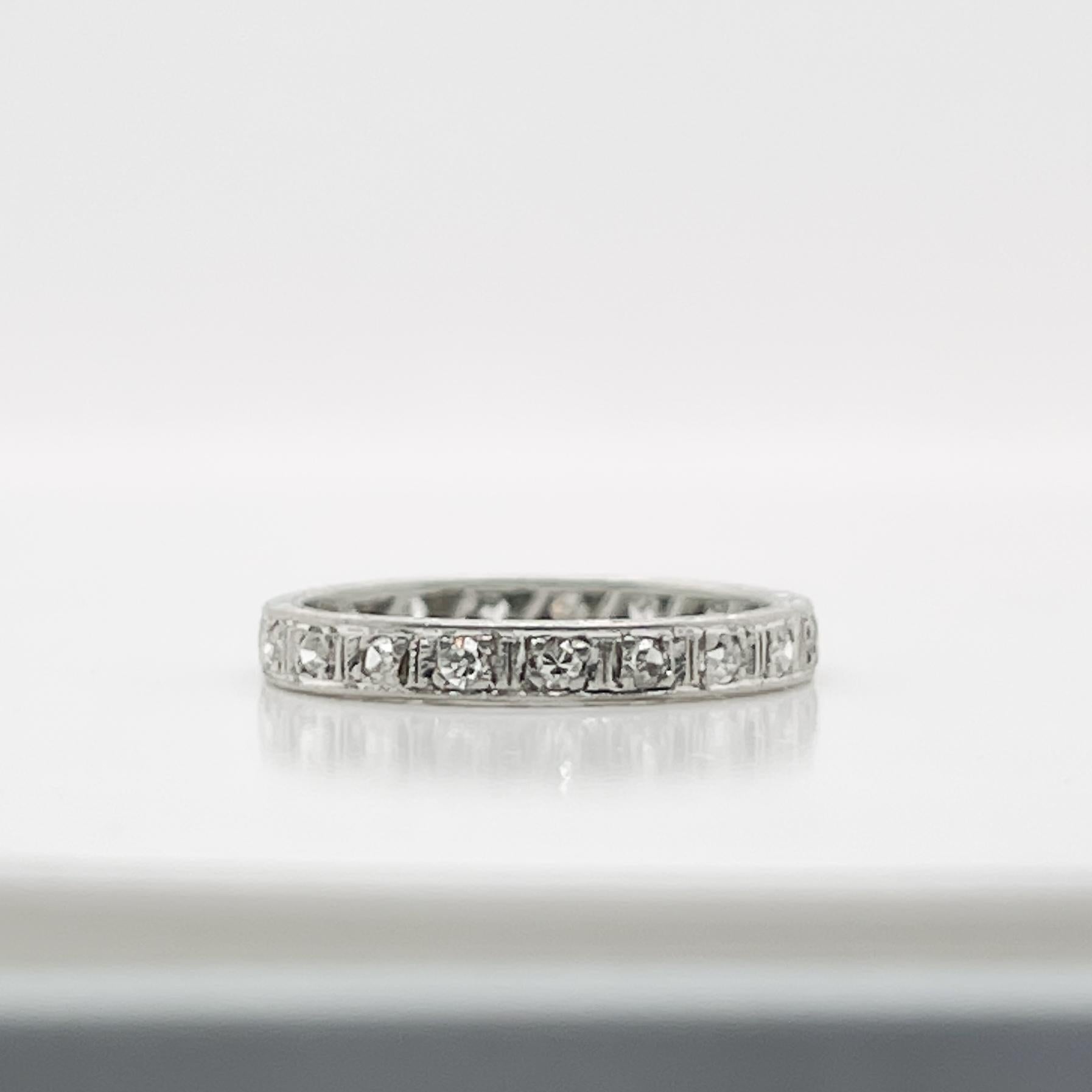 A very fine vintage platinum and diamond eternity band ring.

With round brilliant diamonds prong set in a platinum band that is embellished with decorative engravings on the side of the band.

Simply a wonderful ring!

Date:
20th Century

Overall