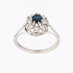 Retro Platinum Ring with Diamonds and Sapphire