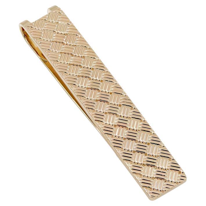 Money clip in a textured basketweave pattern.  Made and signed by RAYMOND YARD.  14K yellow gold.  2
