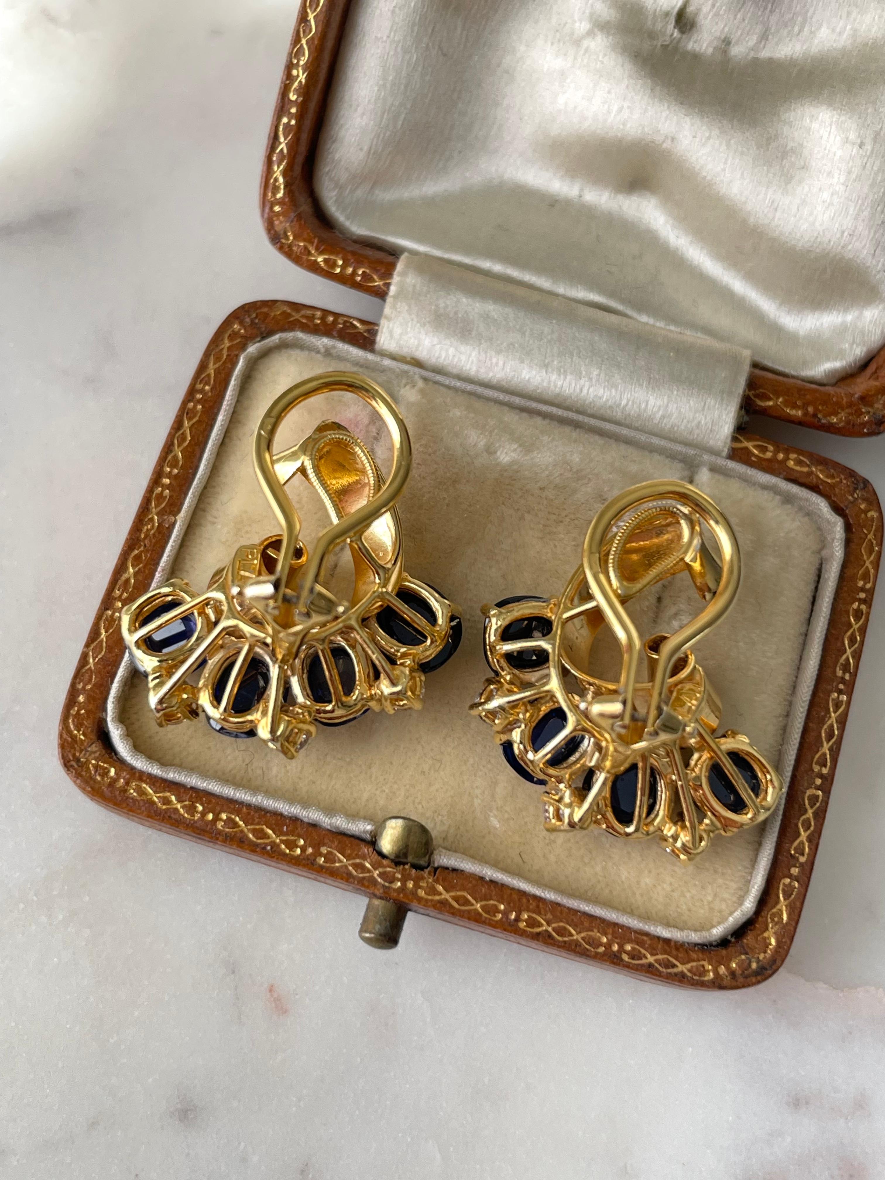 Stunning for day or night, these glamorous 1940's Raymond Yard earrings radiate with 8.8 carats of vivid blue cabochon sapphires and .60 total carats of sparkling brilliant-cut diamonds. Expertly fabricated in platinum, these earrings were plated in