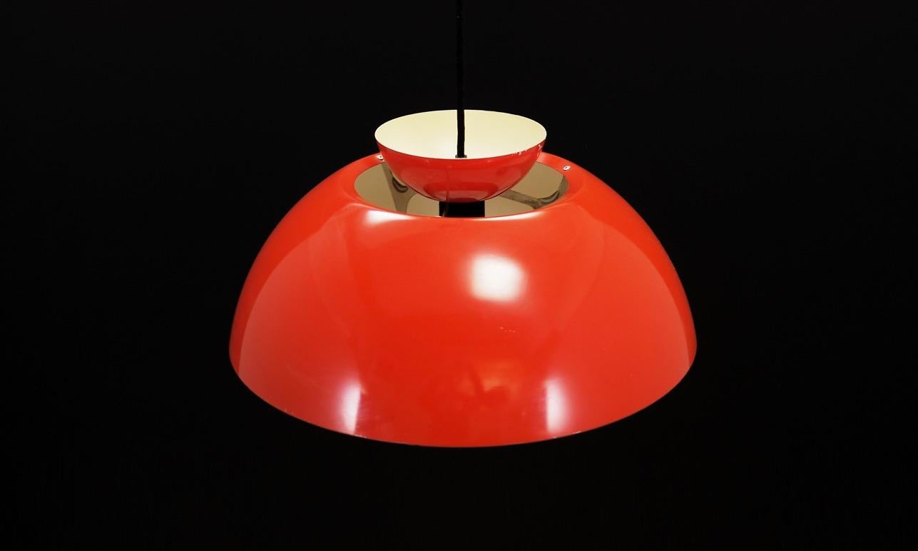 Fantastic lamp from the 1960s-1970s. Scandinavian design, Minimalist form. The lamp is made of steel in red colour. Maintained in good condition (minor bruises and scratches), directly for use.

Dimensions: Height 20 cm, diameter 38 cm.