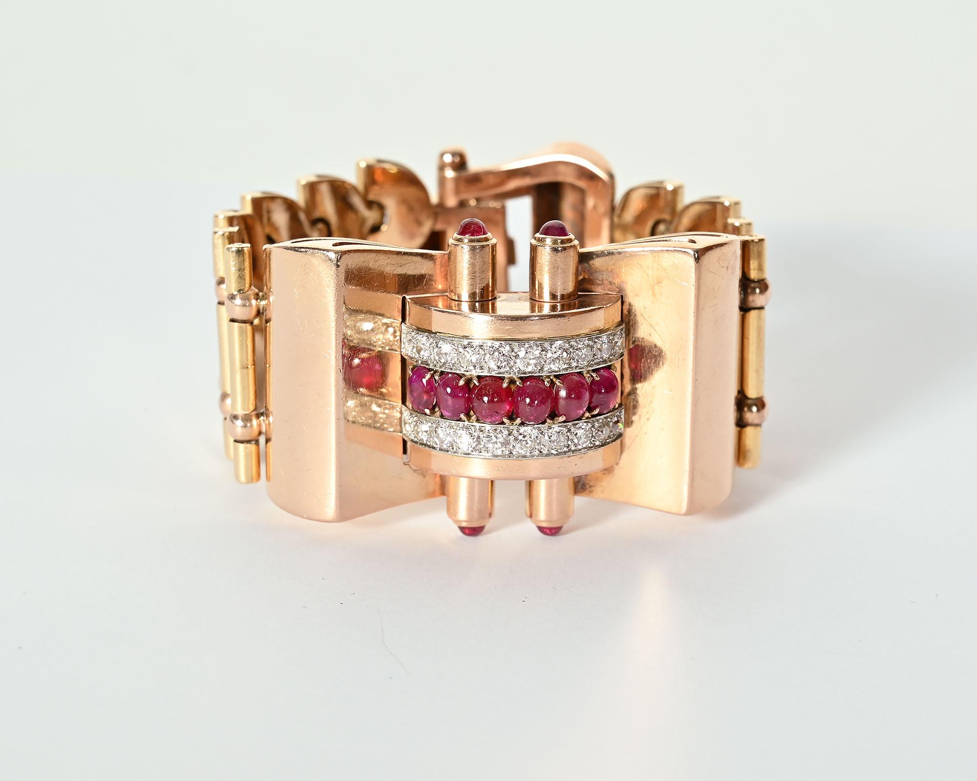 Unusual Retro bracelet of rose qold with a clasp of diamonds and rubies.  The bracelet has 18 old European cut diamonds weighing a total of 3.06 carats; G color and SI 1 clarity. It has six oval cabochon rubies, The links are an unusual row of